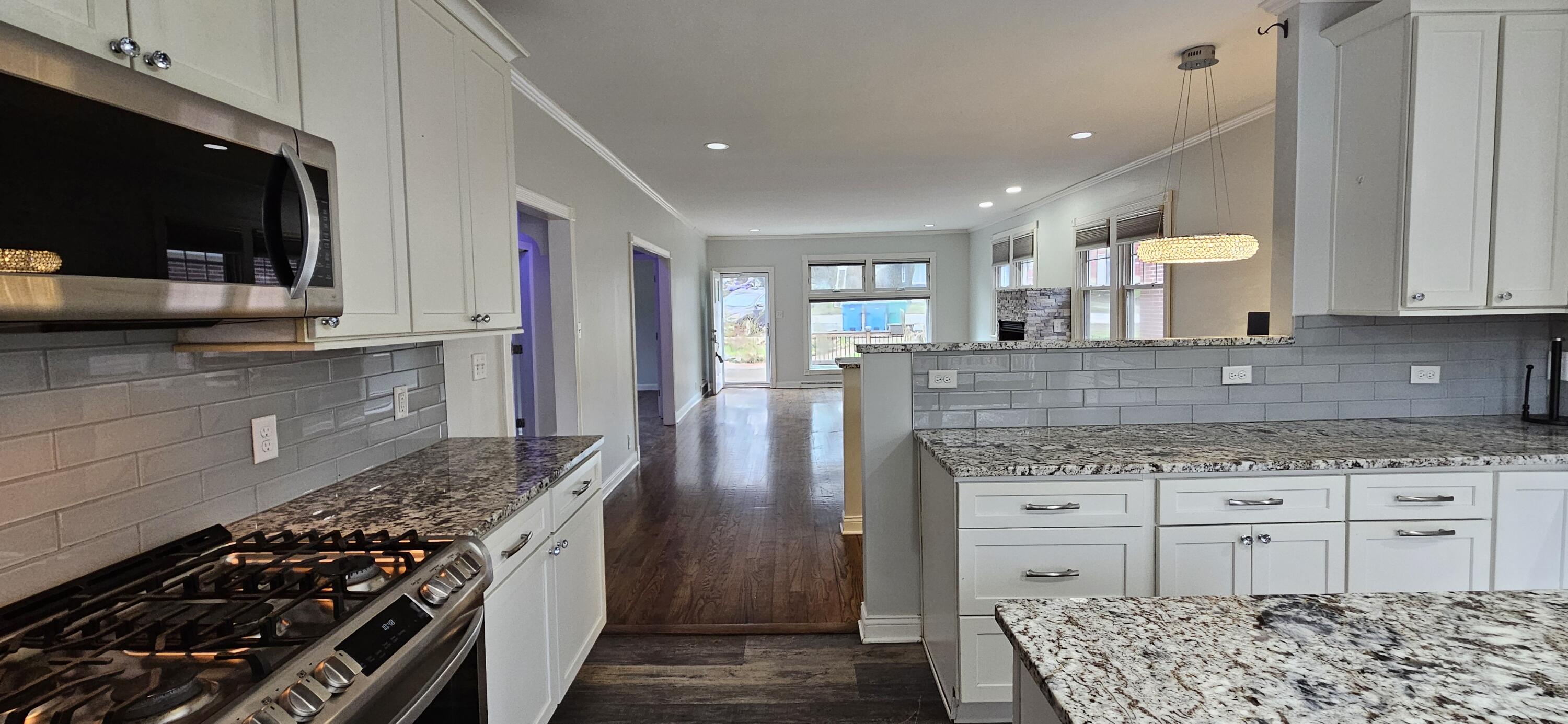 7419 Maple Avenue Gary, IN 46403 - Photo 18 of 93 a kitchen with granite countertop a stove and cabinets