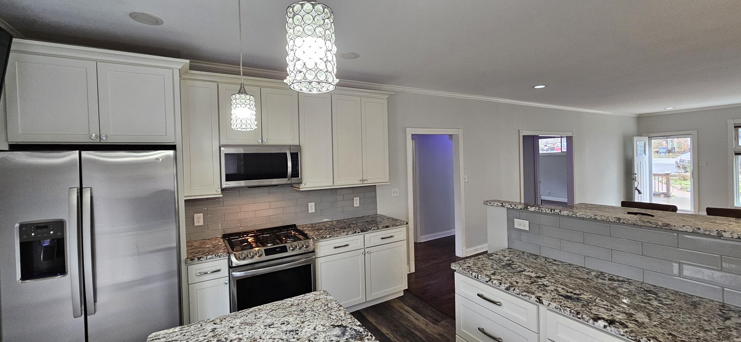 7419 Maple Avenue Gary, IN 46403 - Photo 24 of 93 a kitchen with stainless steel appliances granite countertop a sink stove and refrigerator