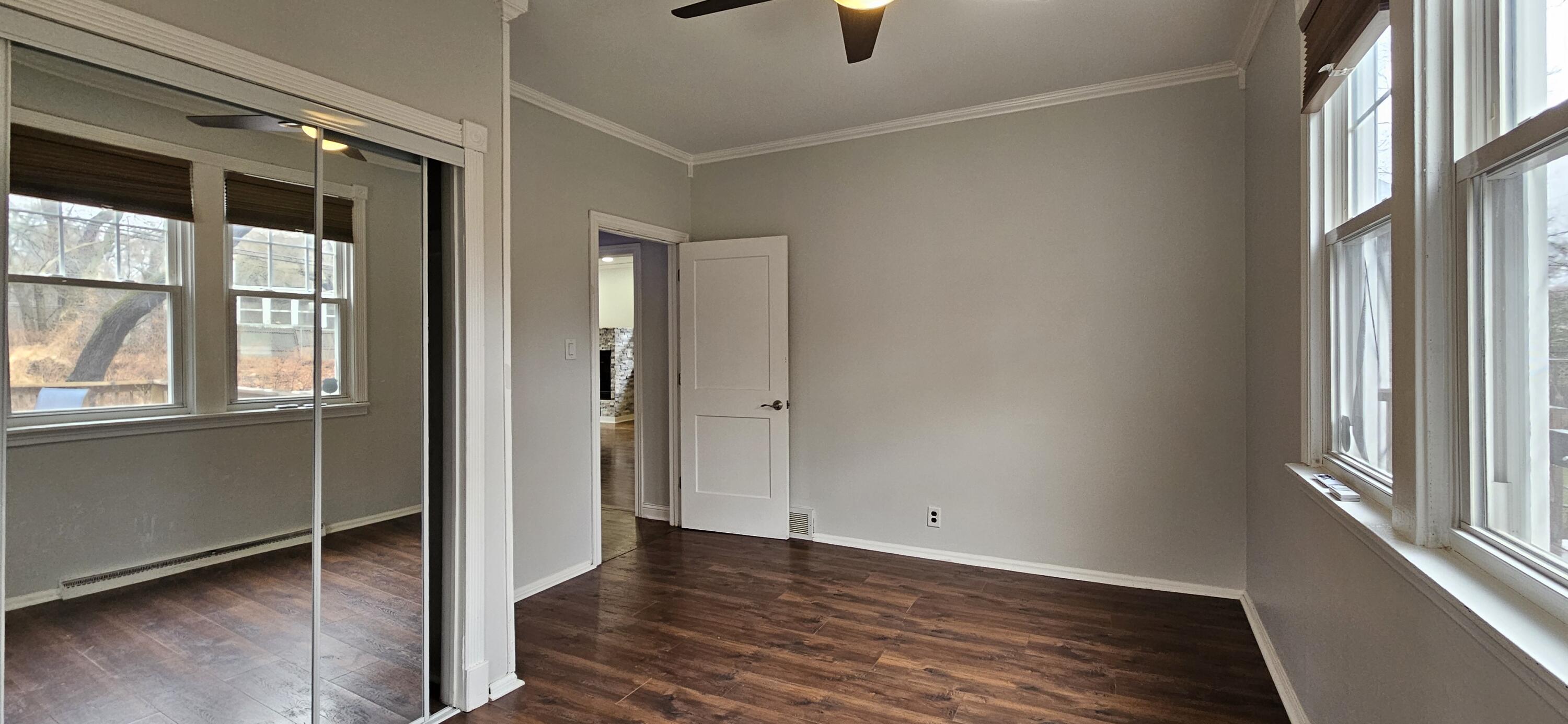 7419 Maple Avenue Gary, IN 46403 - Photo 41 of 93 a view of an empty room with wooden floor and a window
