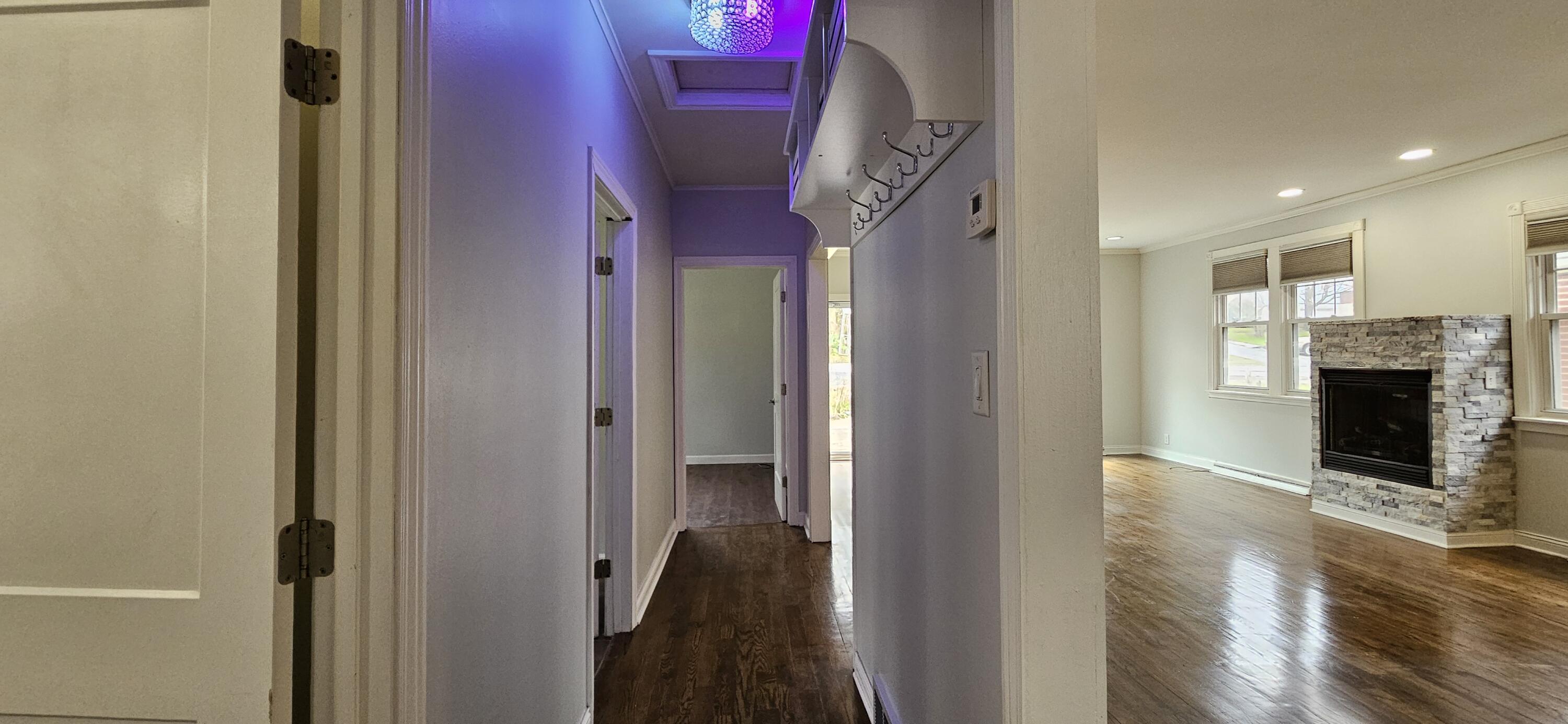 7419 Maple Avenue Gary, IN 46403 - Photo 42 of 93 a view of a hallway with wooden floor and a fireplace