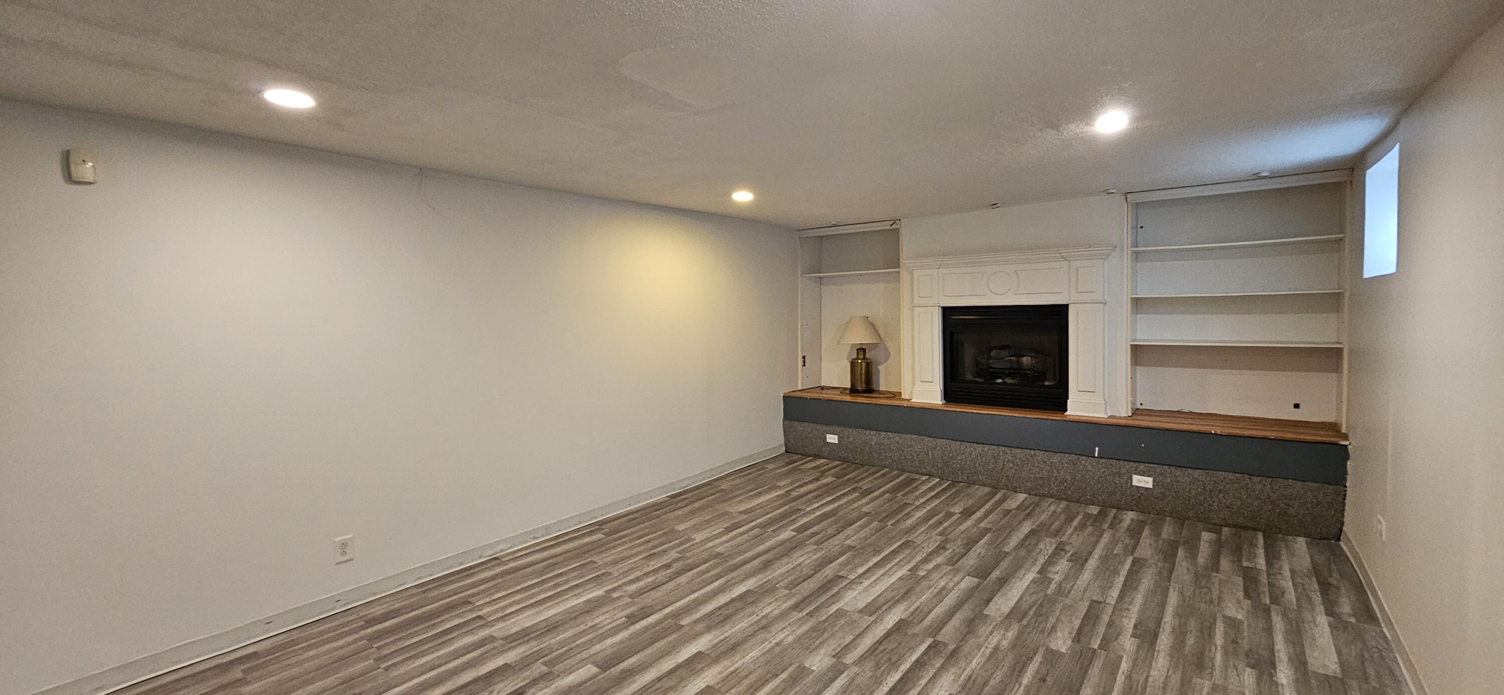 7419 Maple Avenue Gary, IN 46403 - Photo 59 of 93 a view of empty room with a fireplace and wooden floor