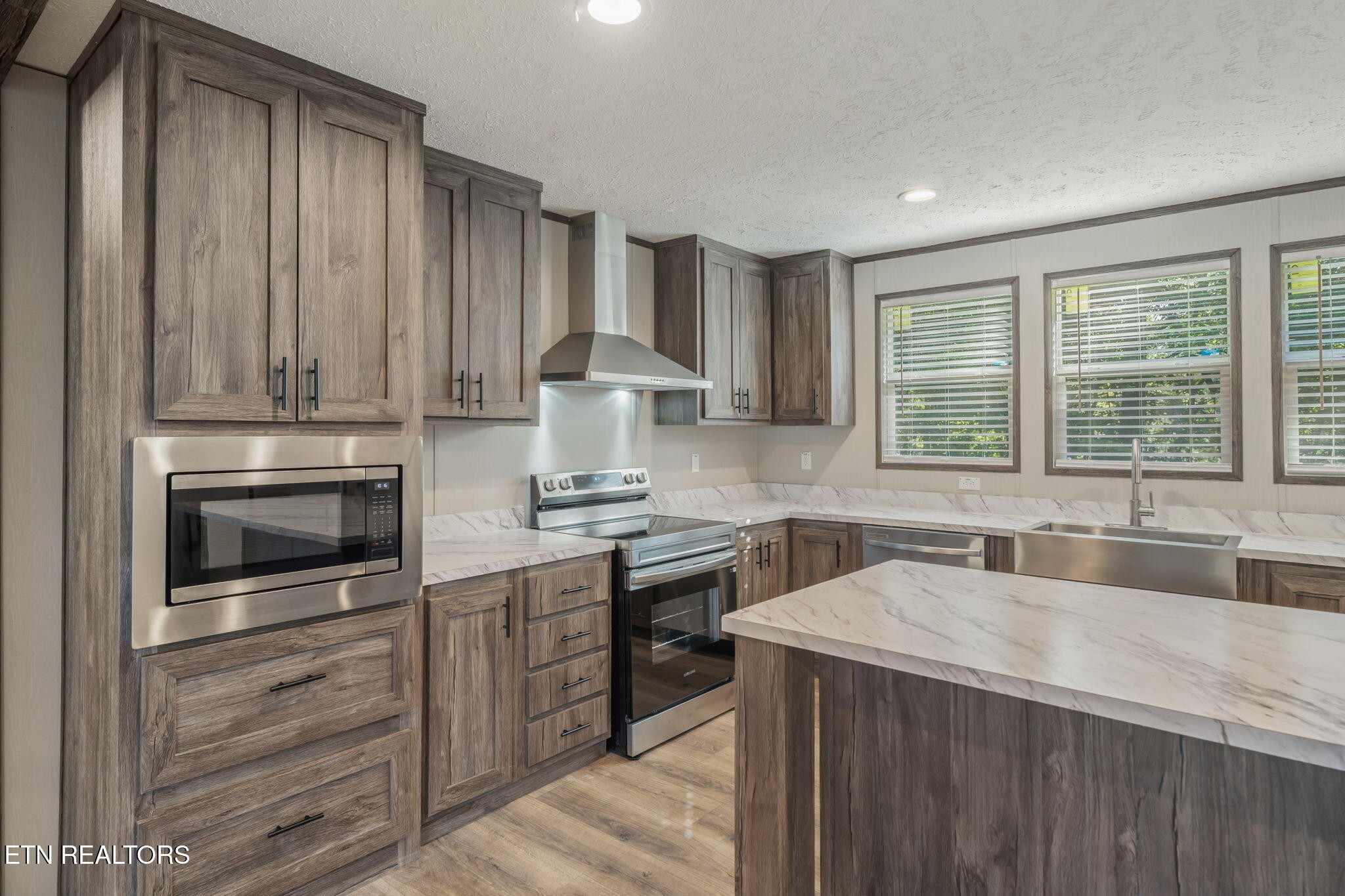 400 Matlock Trail Loudon, TN 37774 - Photo 11 of 50 a kitchen with a stove a sink and a microwave