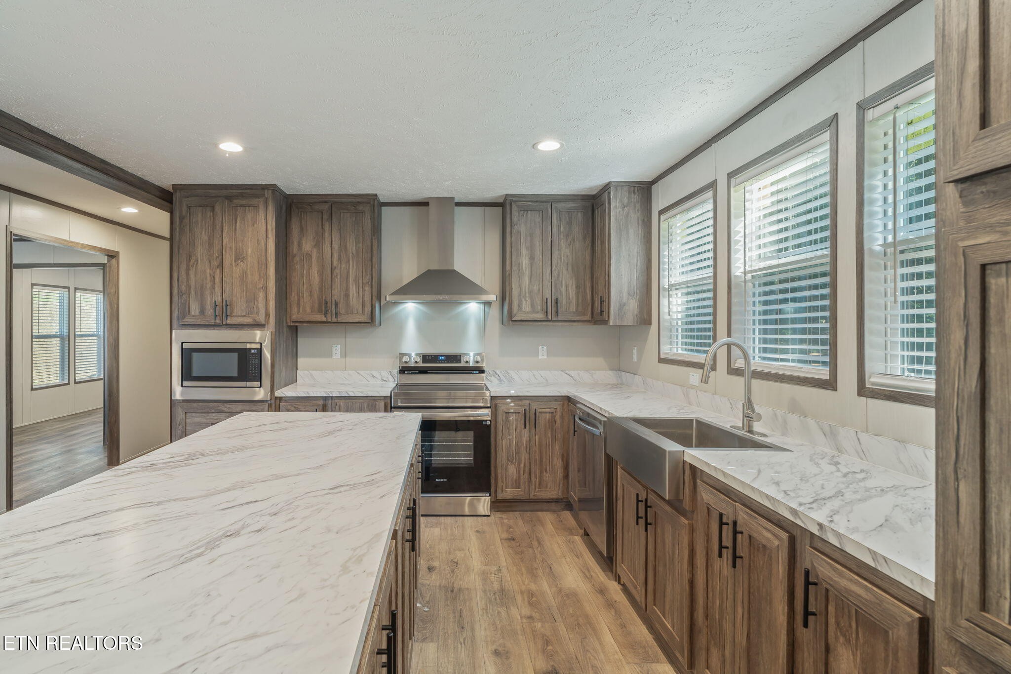400 Matlock Trail Loudon, TN 37774 - Photo 13 of 50 a kitchen with stainless steel appliances granite countertop a sink stove and cabinets