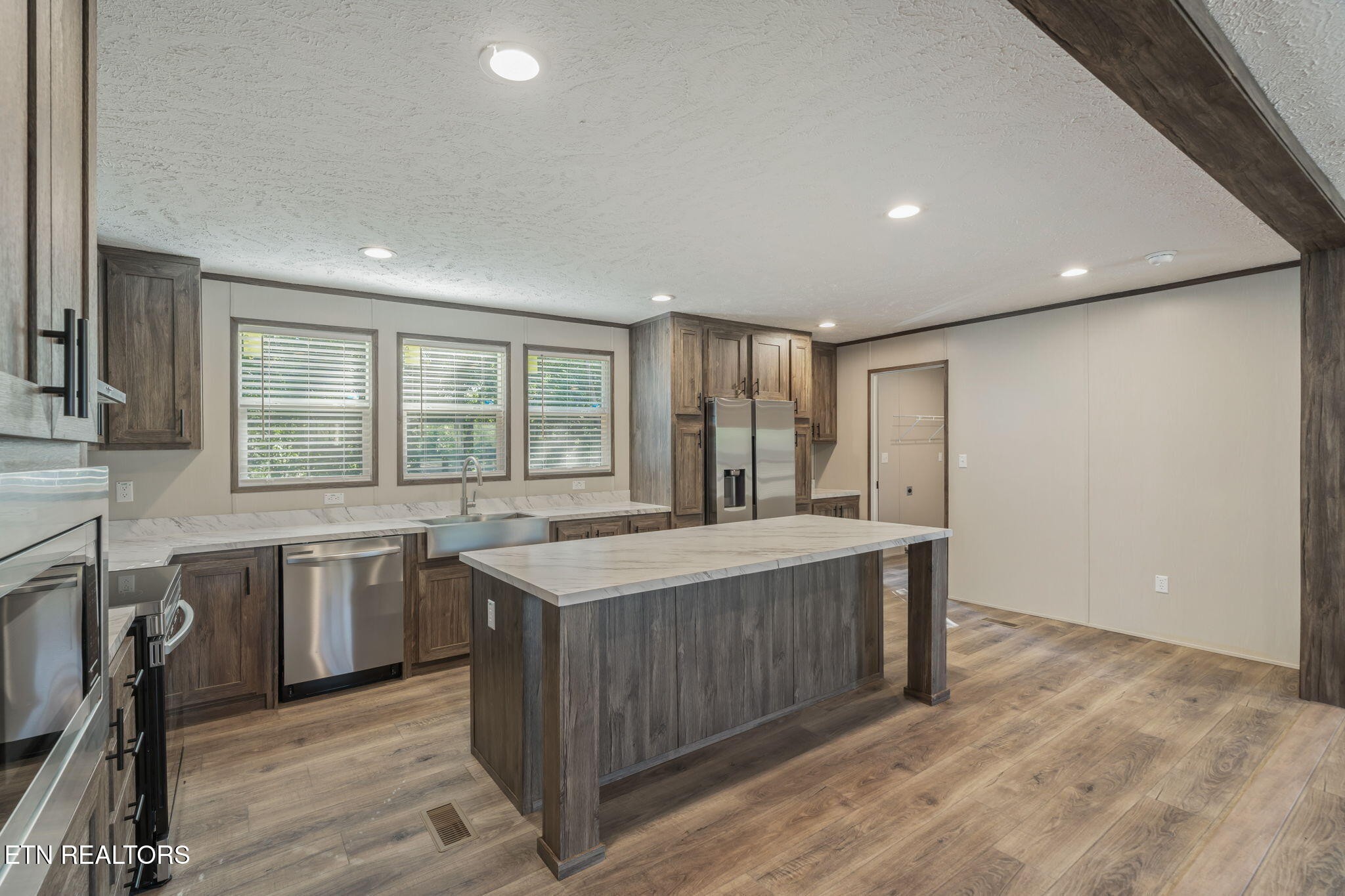 400 Matlock Trail Loudon, TN 37774 - Photo 15 of 50 a kitchen with stainless steel appliances granite countertop a sink stove and refrigerator