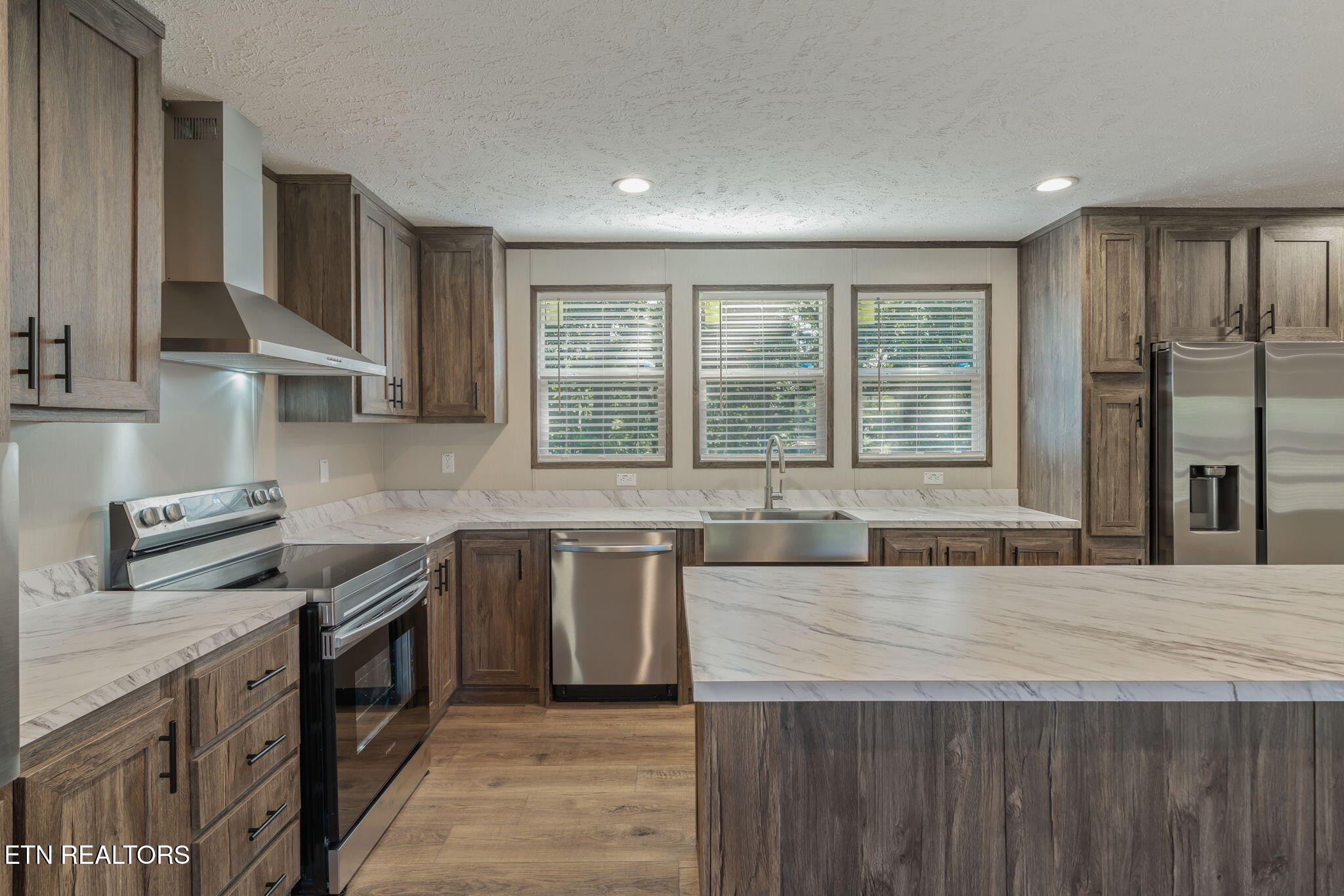 400 Matlock Trail Loudon, TN 37774 - Photo 16 of 50 a kitchen with stainless steel appliances granite countertop a sink stove and refrigerator