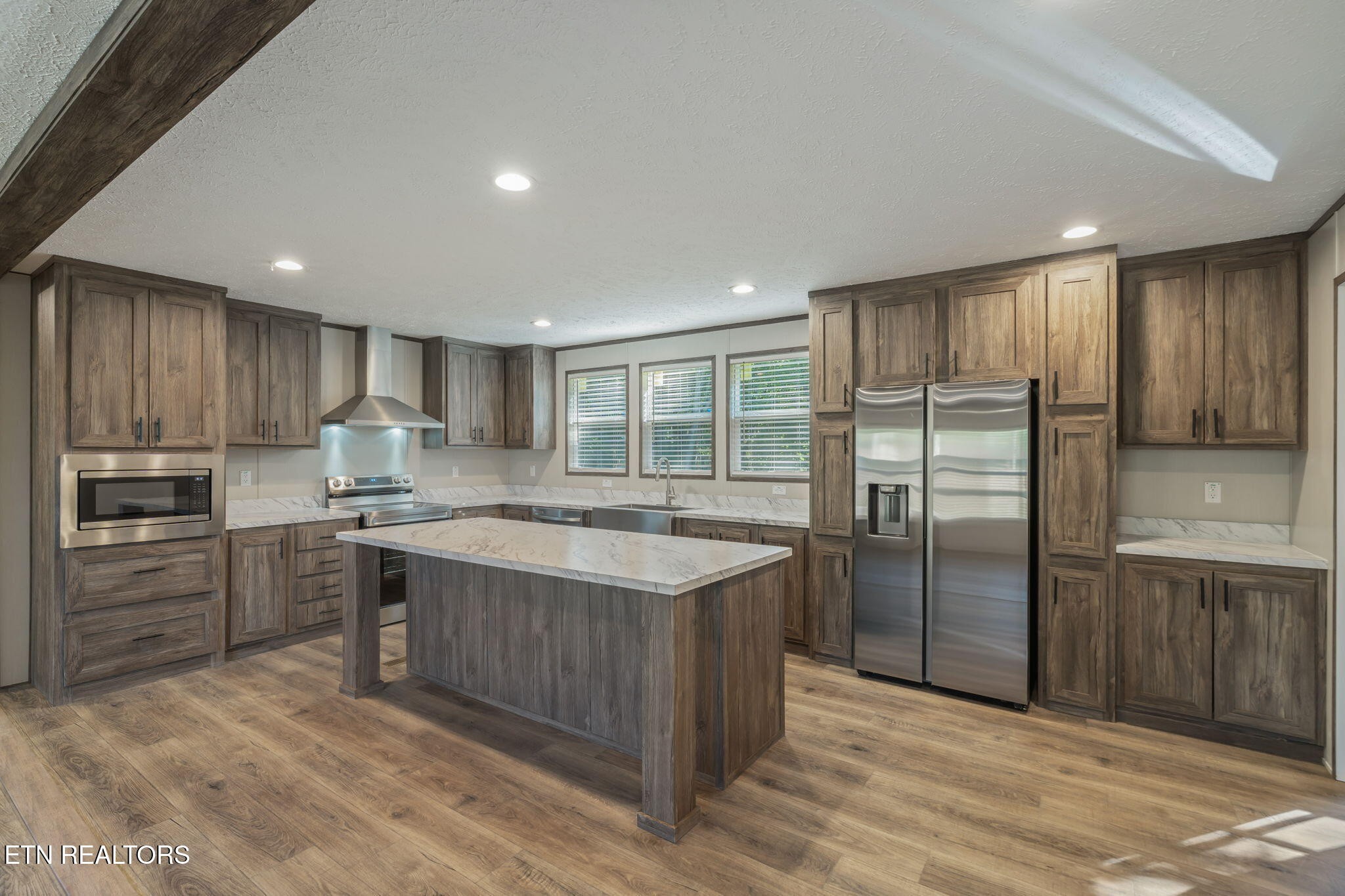 400 Matlock Trail Loudon, TN 37774 - Photo 17 of 50 a kitchen with kitchen island granite countertop a sink stove and refrigerator