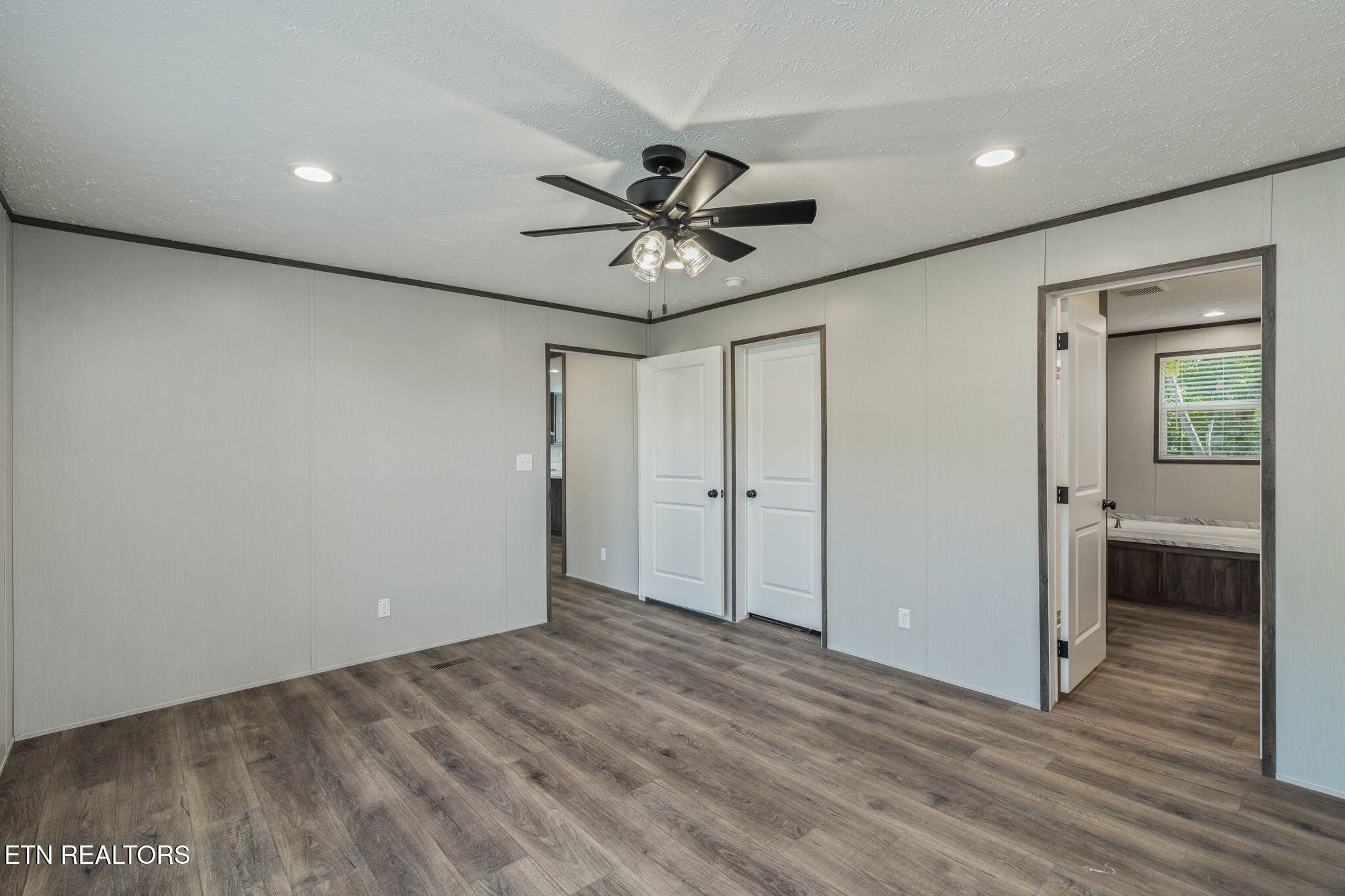 400 Matlock Trail Loudon, TN 37774 - Photo 19 of 50 a view of a livingroom with a chandelier fan and wooden floor