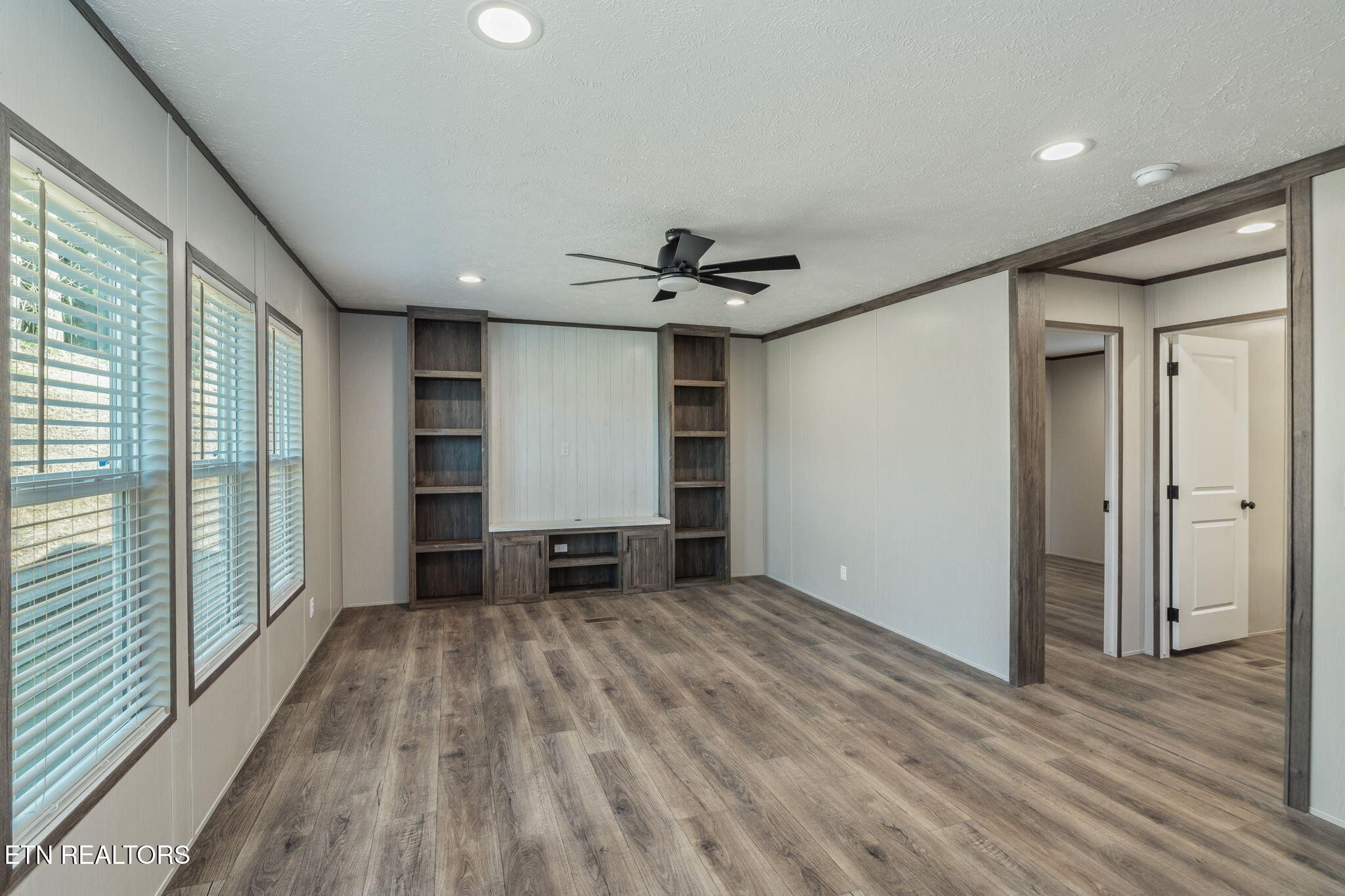400 Matlock Trail Loudon, TN 37774 - Photo 22 of 50 a view of empty room with wooden floor and fan
