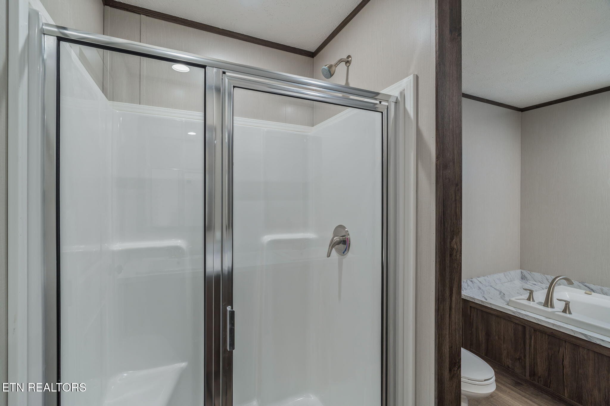 400 Matlock Trail Loudon, TN 37774 - Photo 24 of 50 a bathroom with a glass shower door and a sink