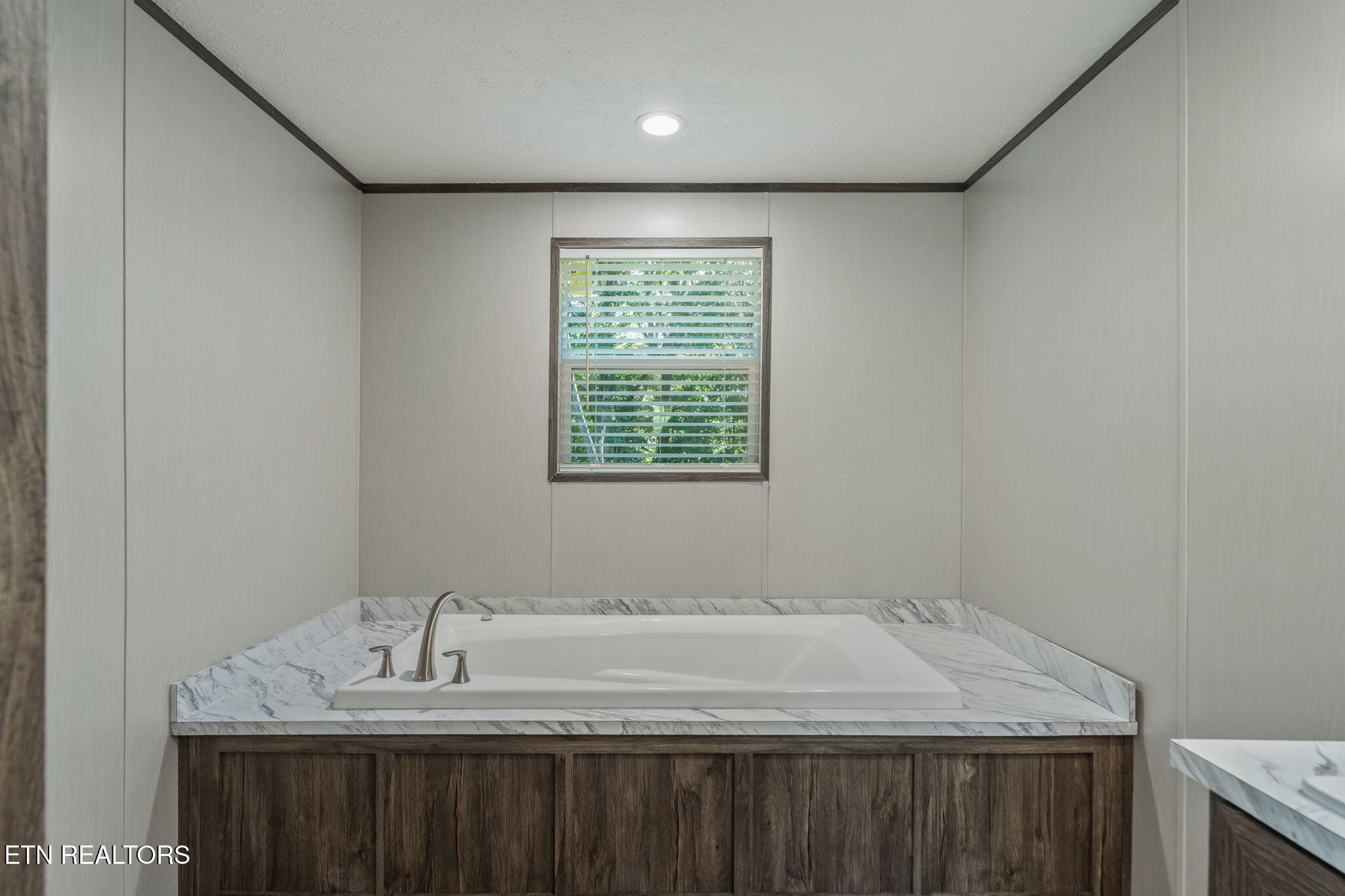 400 Matlock Trail Loudon, TN 37774 - Photo 25 of 50 a bathroom with a granite countertop sink a vanity and a window