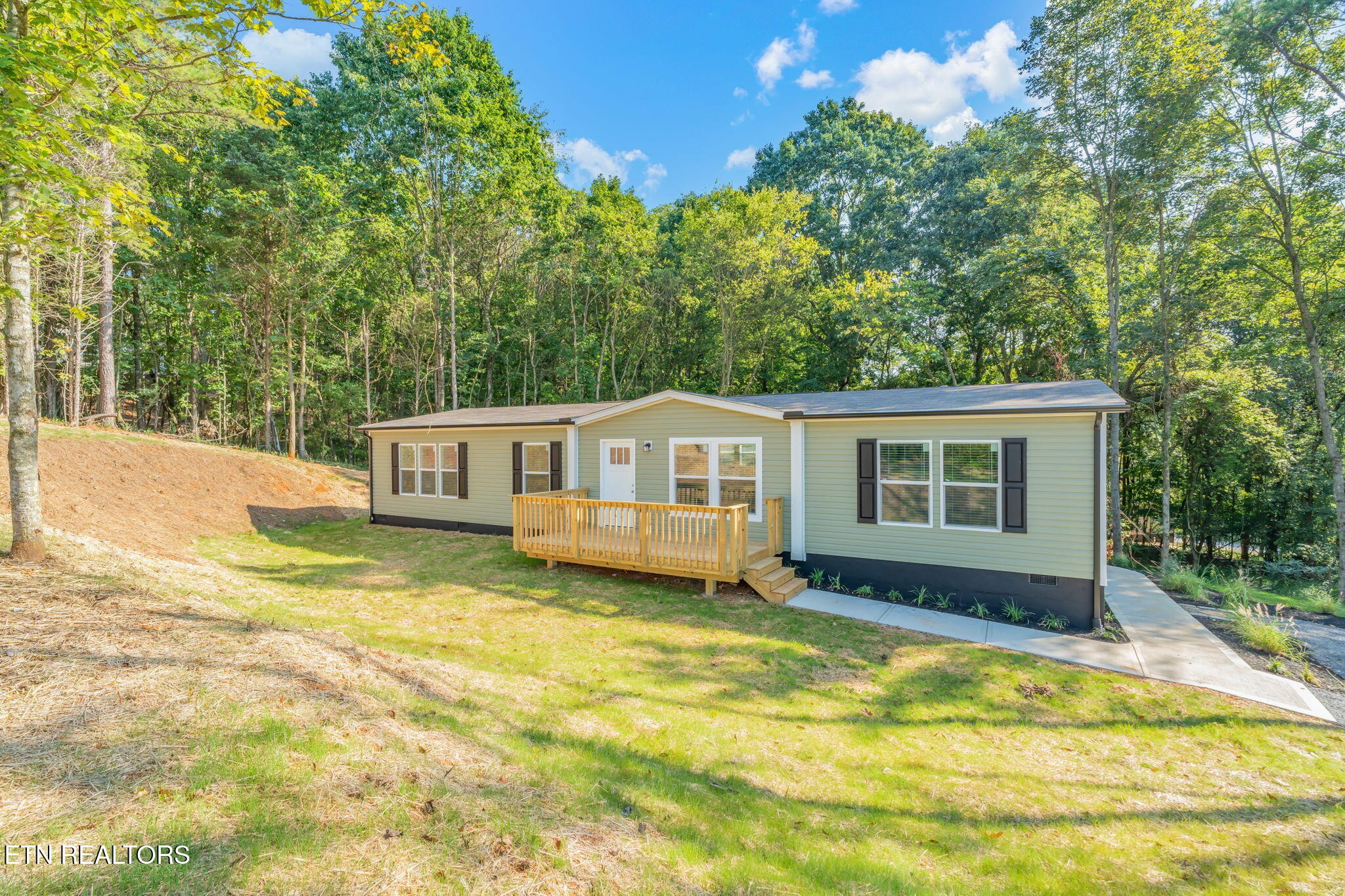 400 Matlock Trail Loudon, TN 37774 - Photo 3 of 50 a front view of a house with a yard