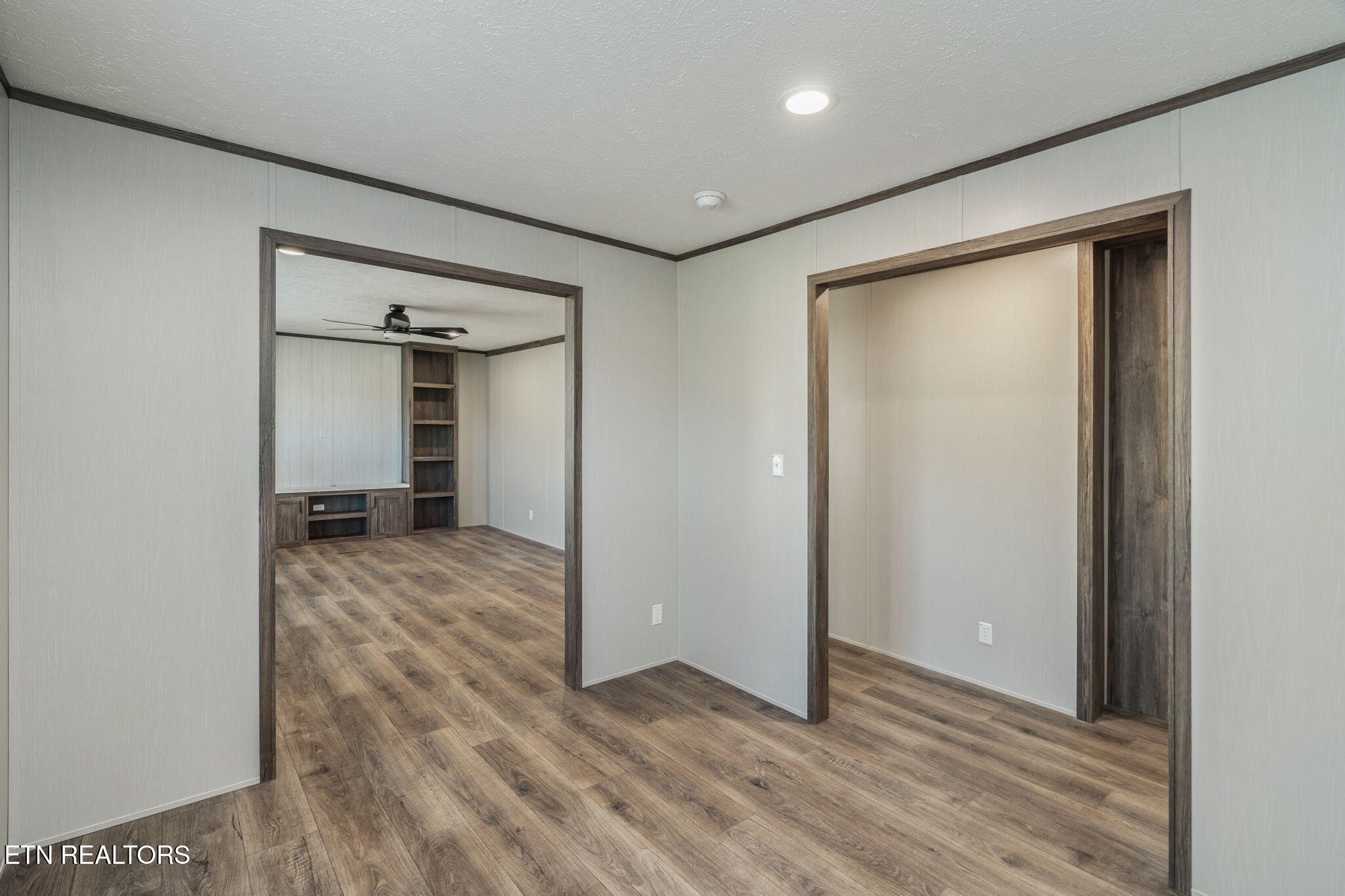 400 Matlock Trail Loudon, TN 37774 - Photo 32 of 50 an empty room with wooden floor and a bathroom