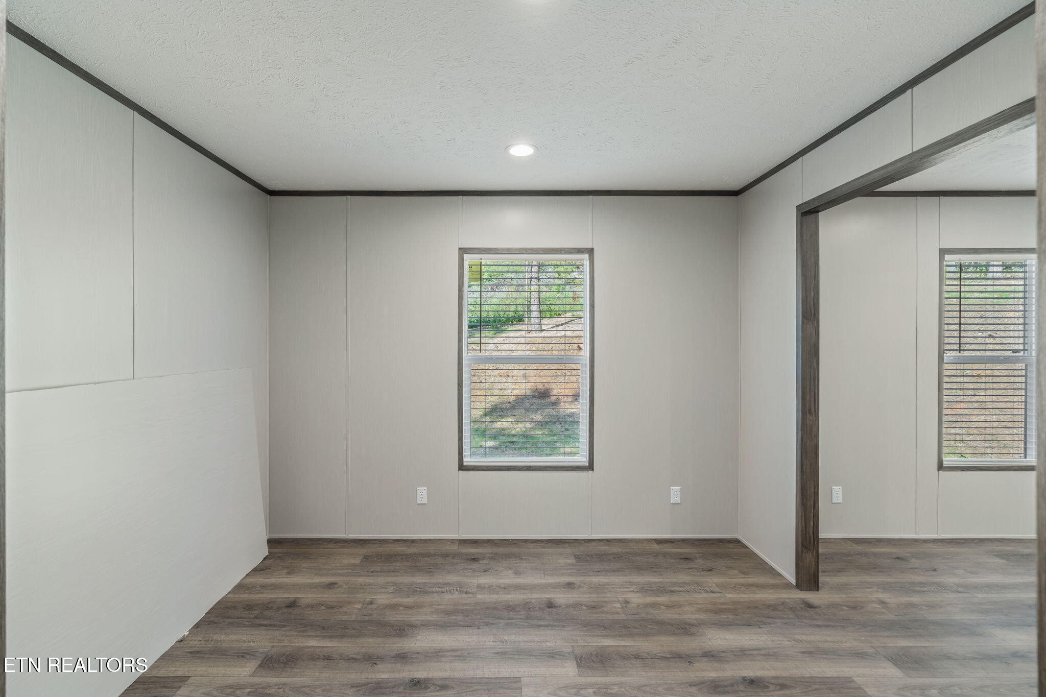 400 Matlock Trail Loudon, TN 37774 - Photo 33 of 50 an empty room with wooden floor and windows