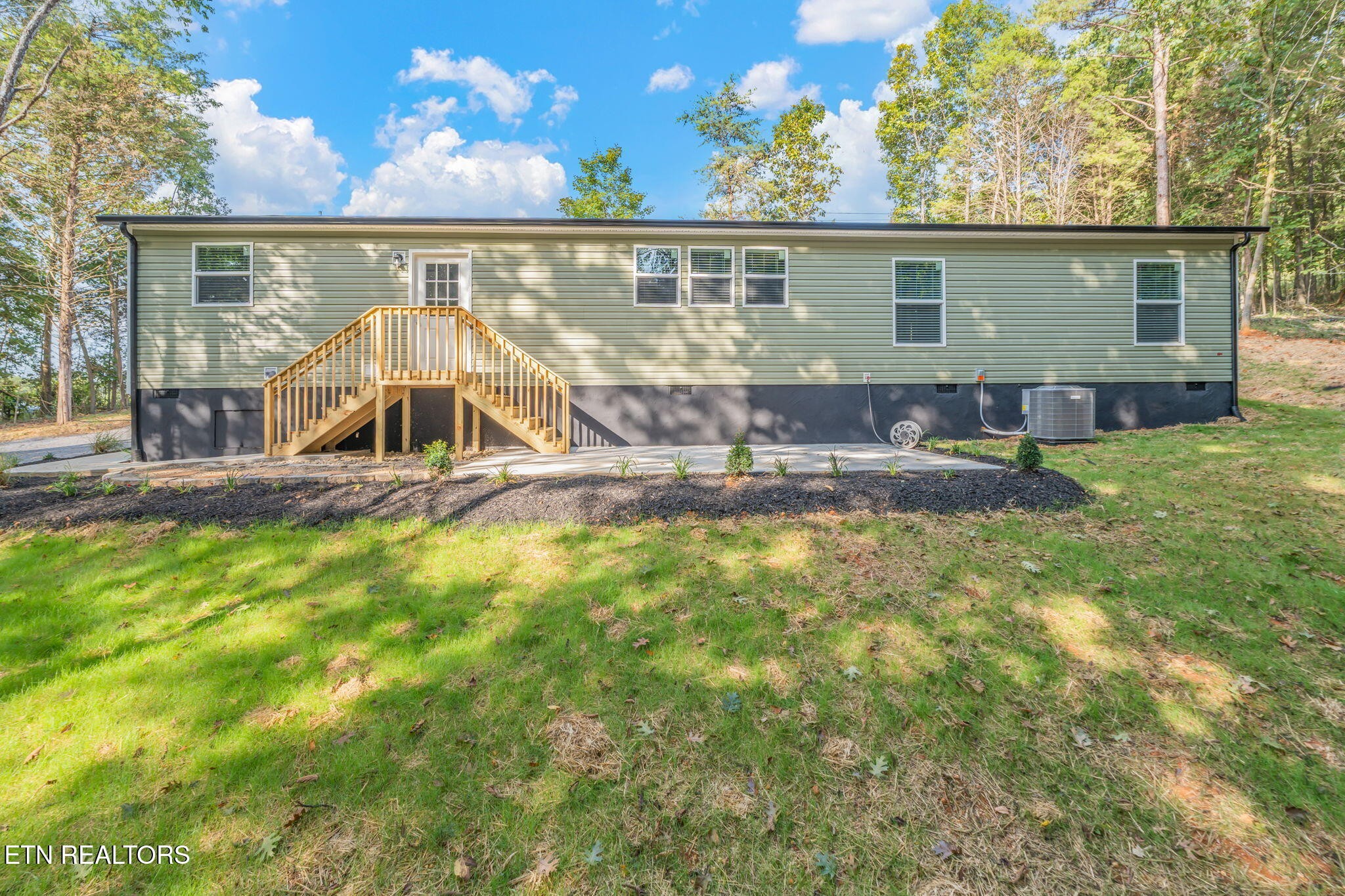 400 Matlock Trail Loudon, TN 37774 - Photo 36 of 50 a view of a house with backyard and sitting area