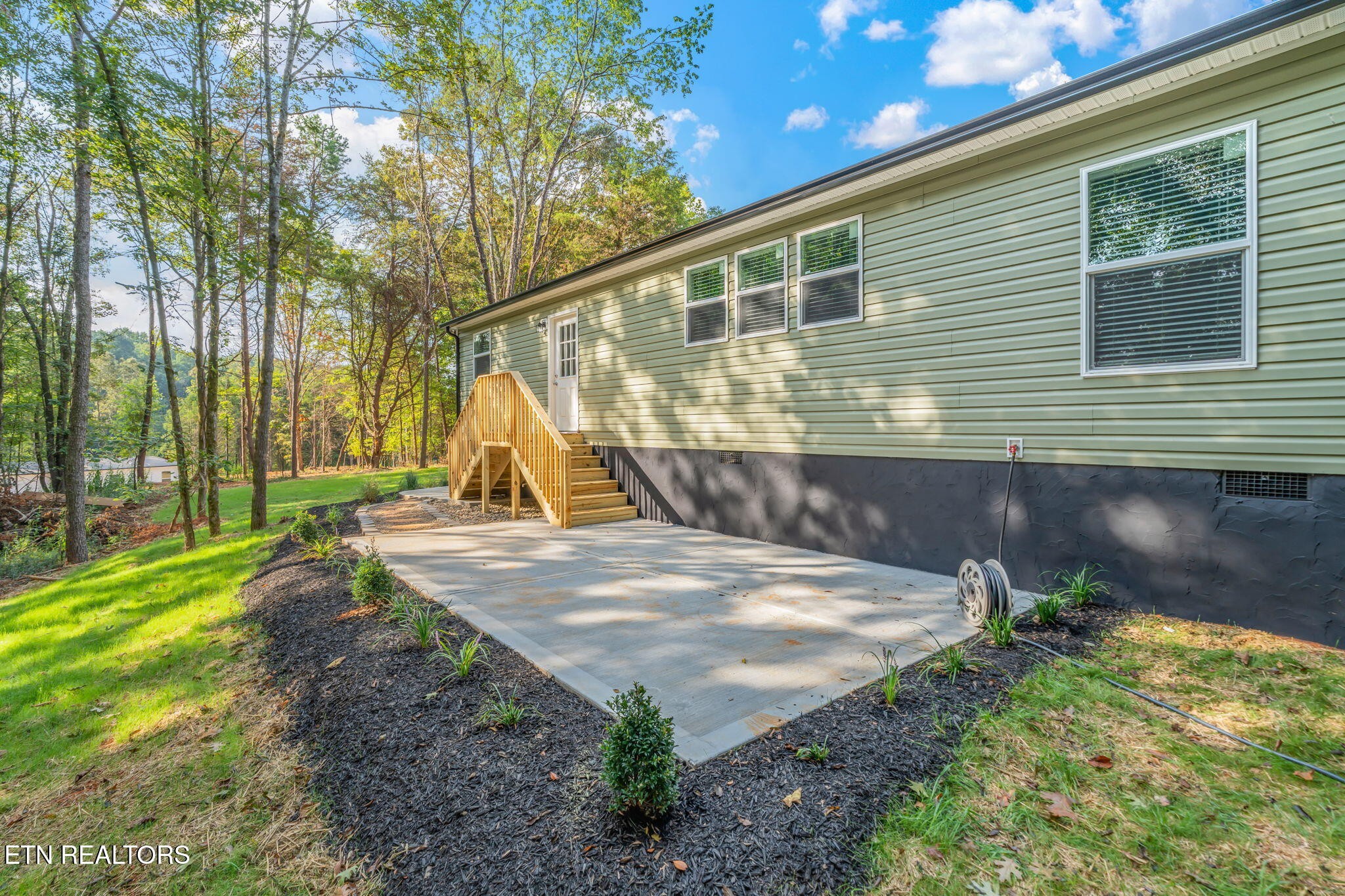 400 Matlock Trail Loudon, TN 37774 - Photo 40 of 50 a view of a backyard with a fountain