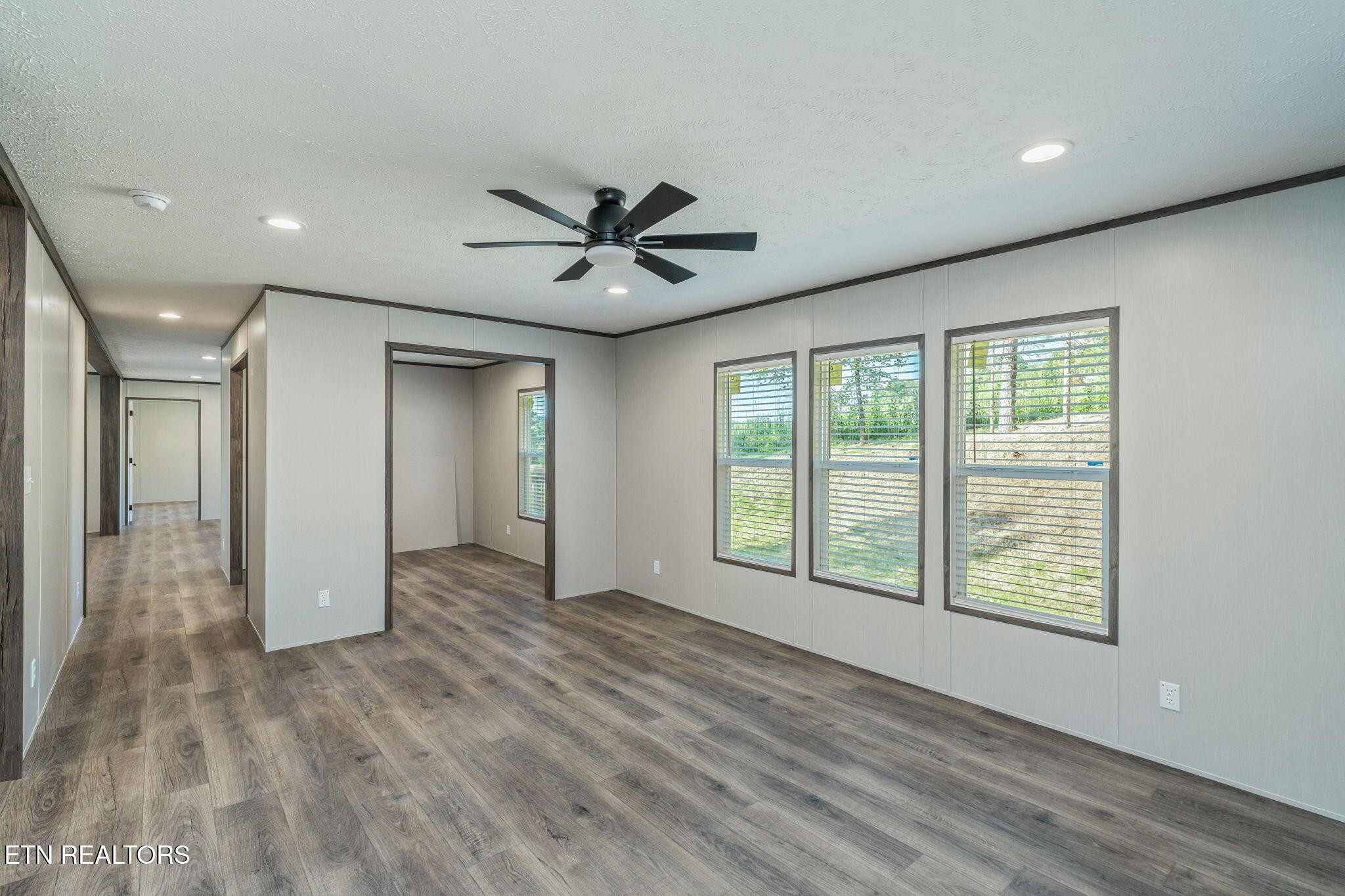 400 Matlock Trail Loudon, TN 37774 - Photo 8 of 50 a view of an empty room with a window and wooden floor