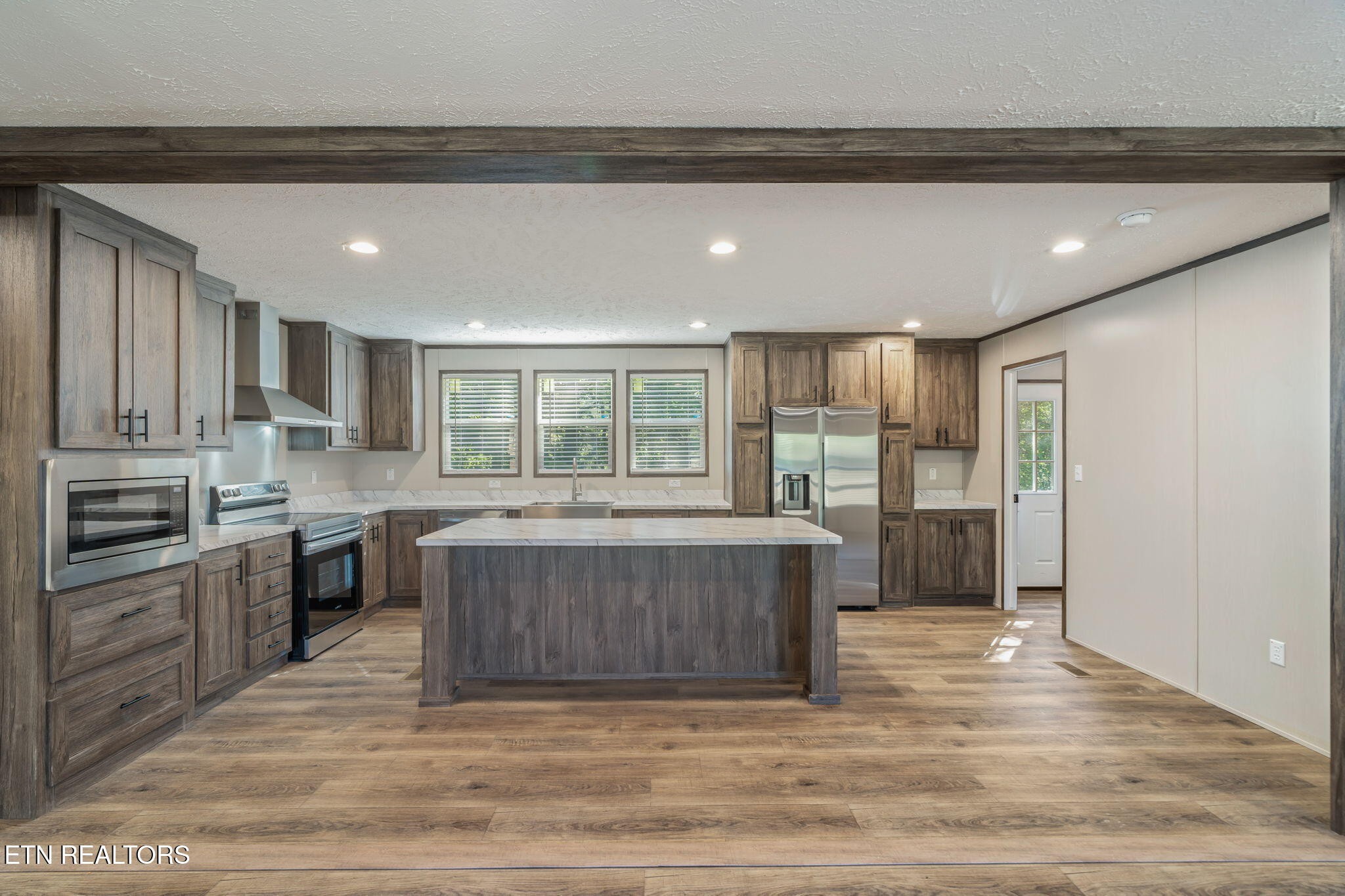 400 Matlock Trail Loudon, TN 37774 - Photo 10 of 50 a kitchen with a stove a refrigerator and a sink