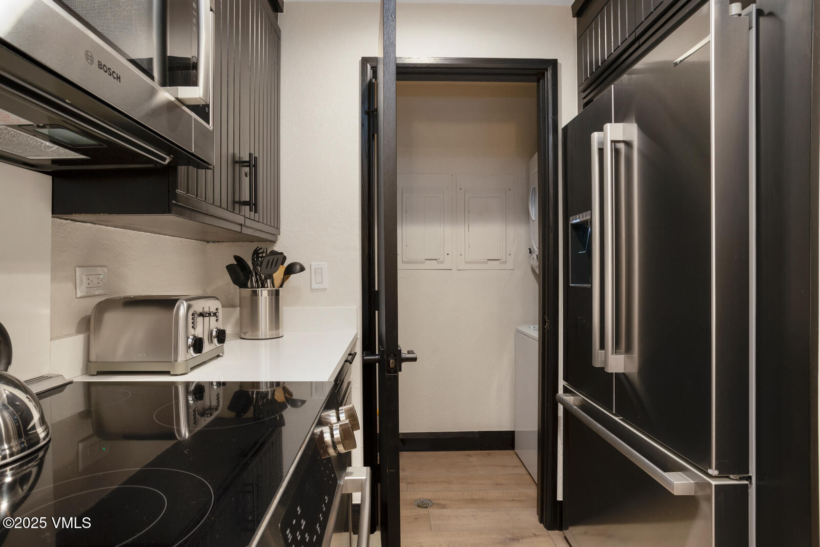 120 Offerson Road, Unit 7320 Beaver Creek, CO 81620 - Photo 12 of 50 Kitchen and laundry closet