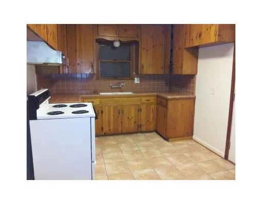 a kitchen with stainless steel appliances granite countertop a sink and a cabinets