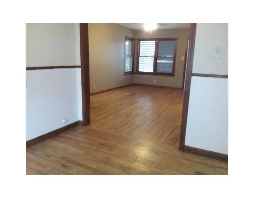 a kitchen with a refrigerator and window