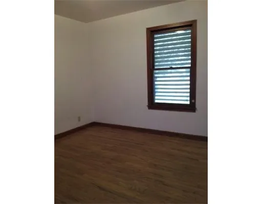 a view of a room that has a window in it