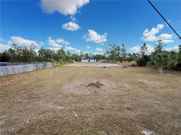 a view of a big yard with an outdoor space