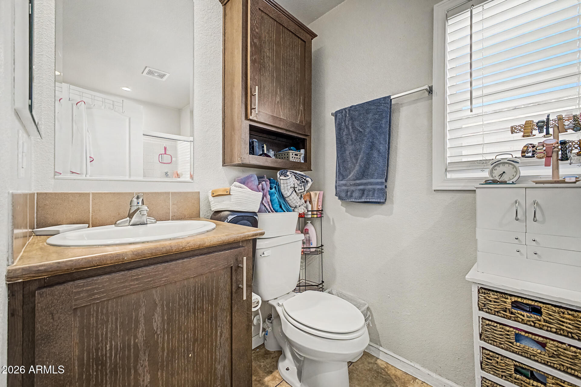 625 West McKellips Road, Unit 393 Mesa, AZ 85201 - Photo 12 of 21 a kitchen with a sink a toilet and cabinets