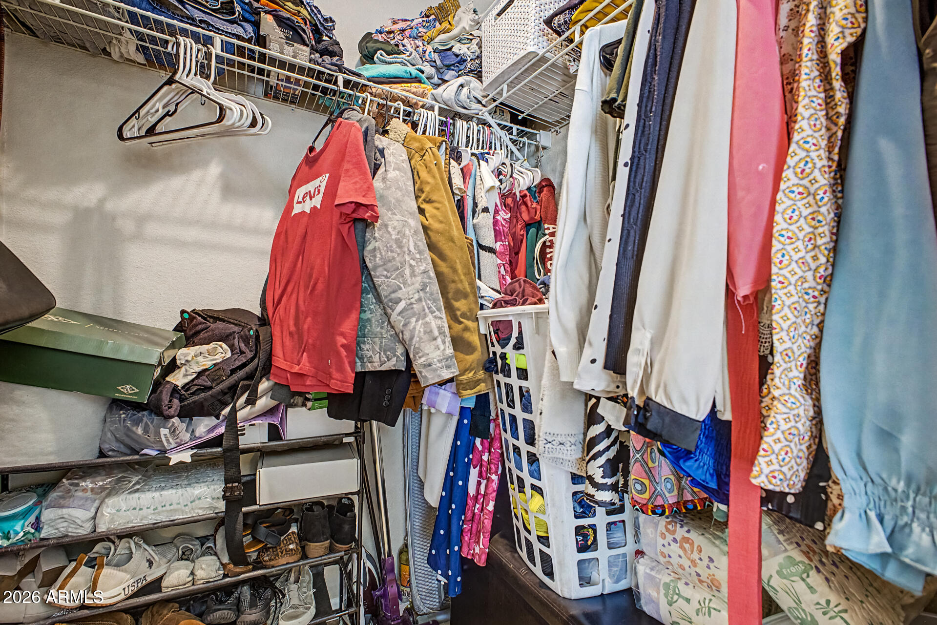 625 West McKellips Road, Unit 393 Mesa, AZ 85201 - Photo 13 of 21 a view of walk in closet with clothes