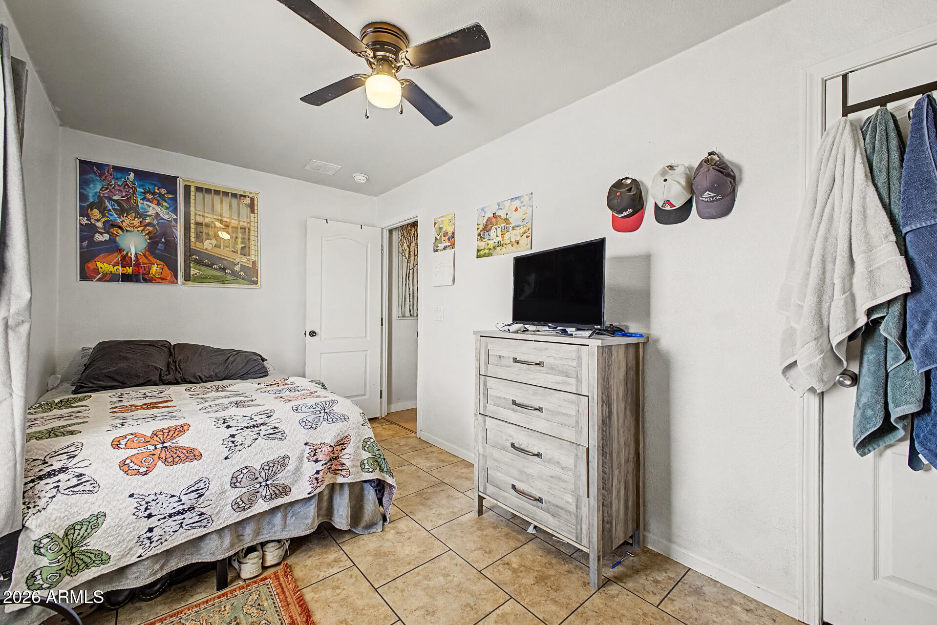 625 West McKellips Road, Unit 393 Mesa, AZ 85201 - Photo 15 of 21 a bedroom with a bed and flat screen tv