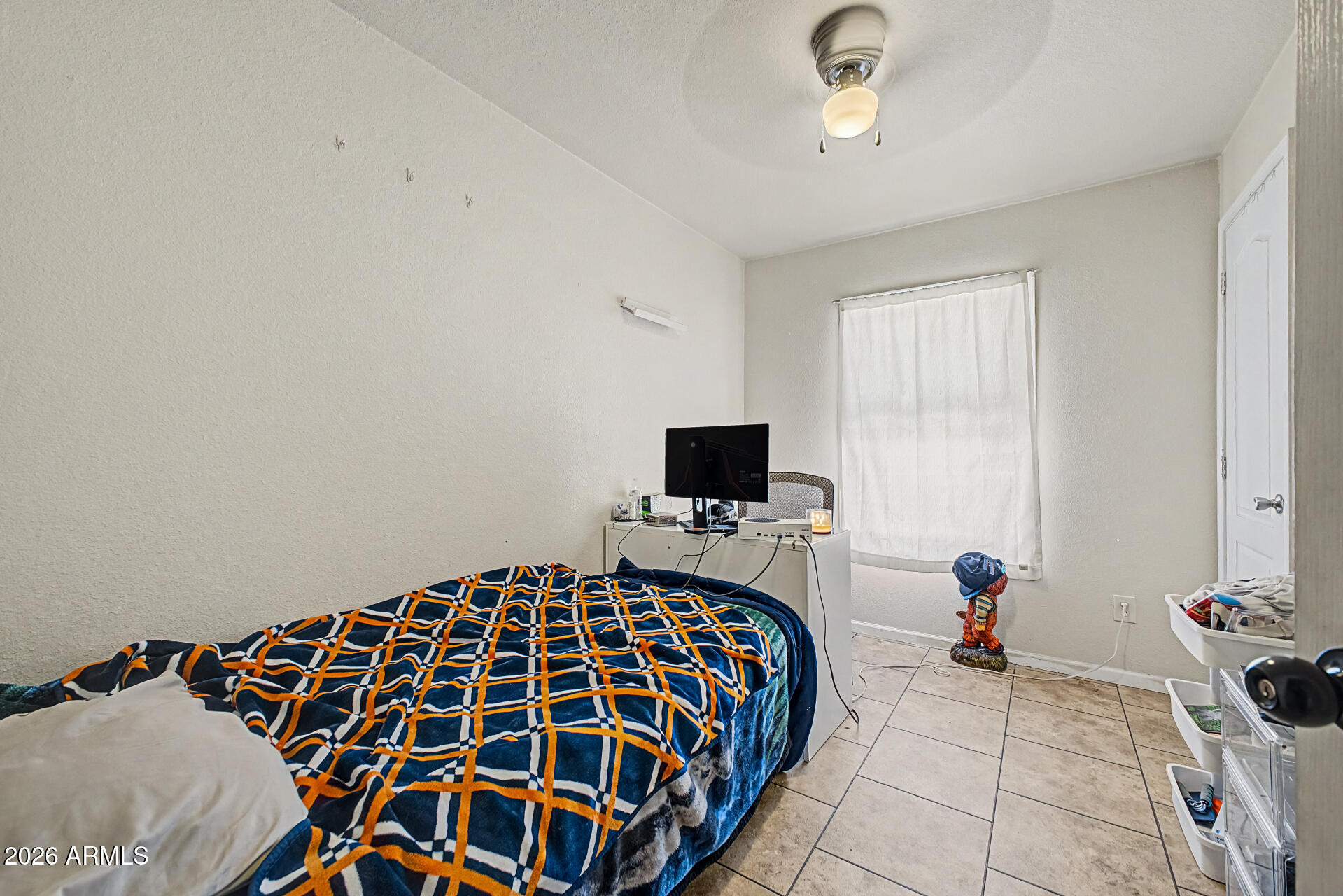 625 West McKellips Road, Unit 393 Mesa, AZ 85201 - Photo 16 of 21 a bedroom with a bed and a flat screen tv