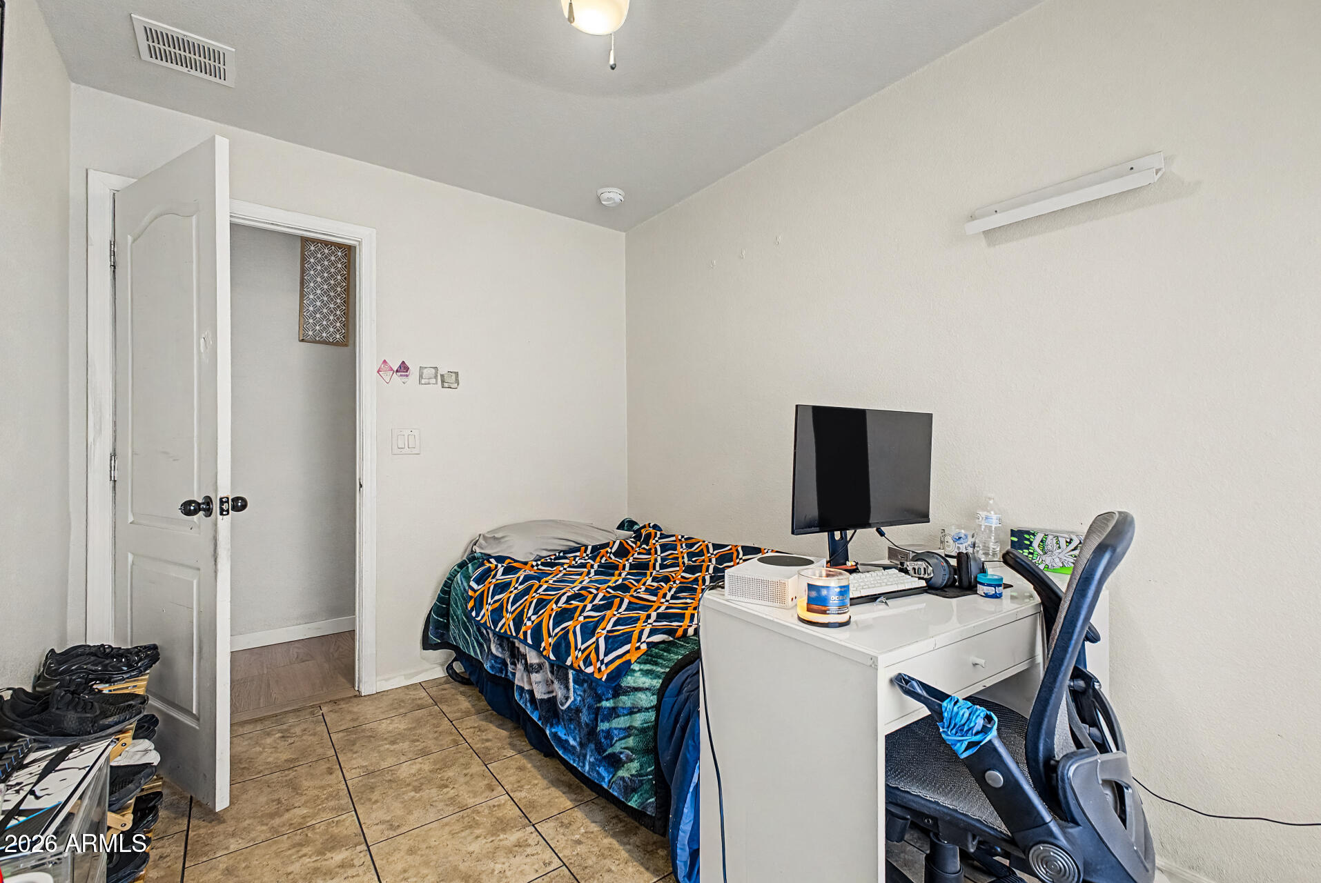 625 West McKellips Road, Unit 393 Mesa, AZ 85201 - Photo 17 of 21 a bedroom with a bed and a table in it
