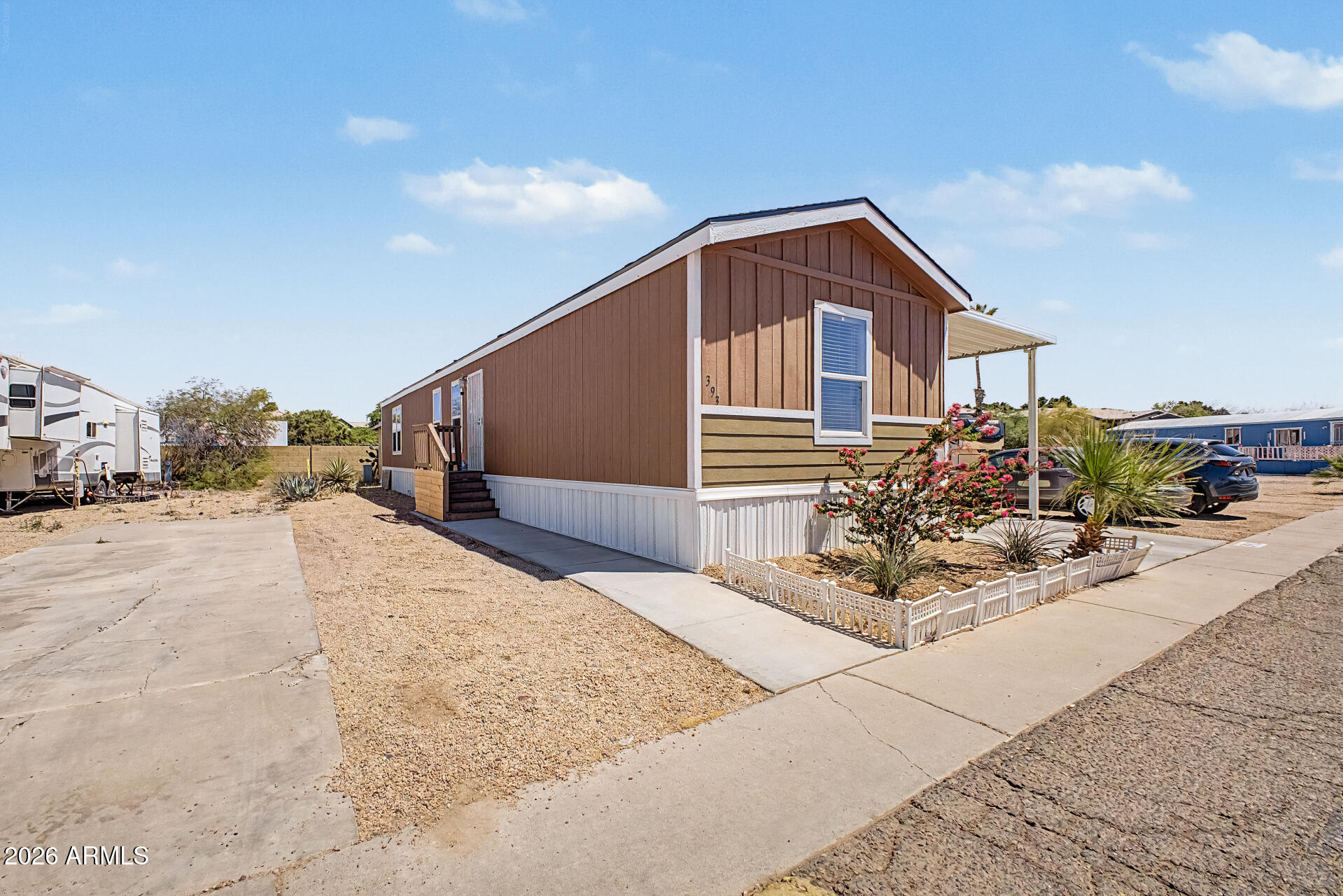 625 West McKellips Road, Unit 393 Mesa, AZ 85201 - Photo 2 of 21 a view of a house with a yard
