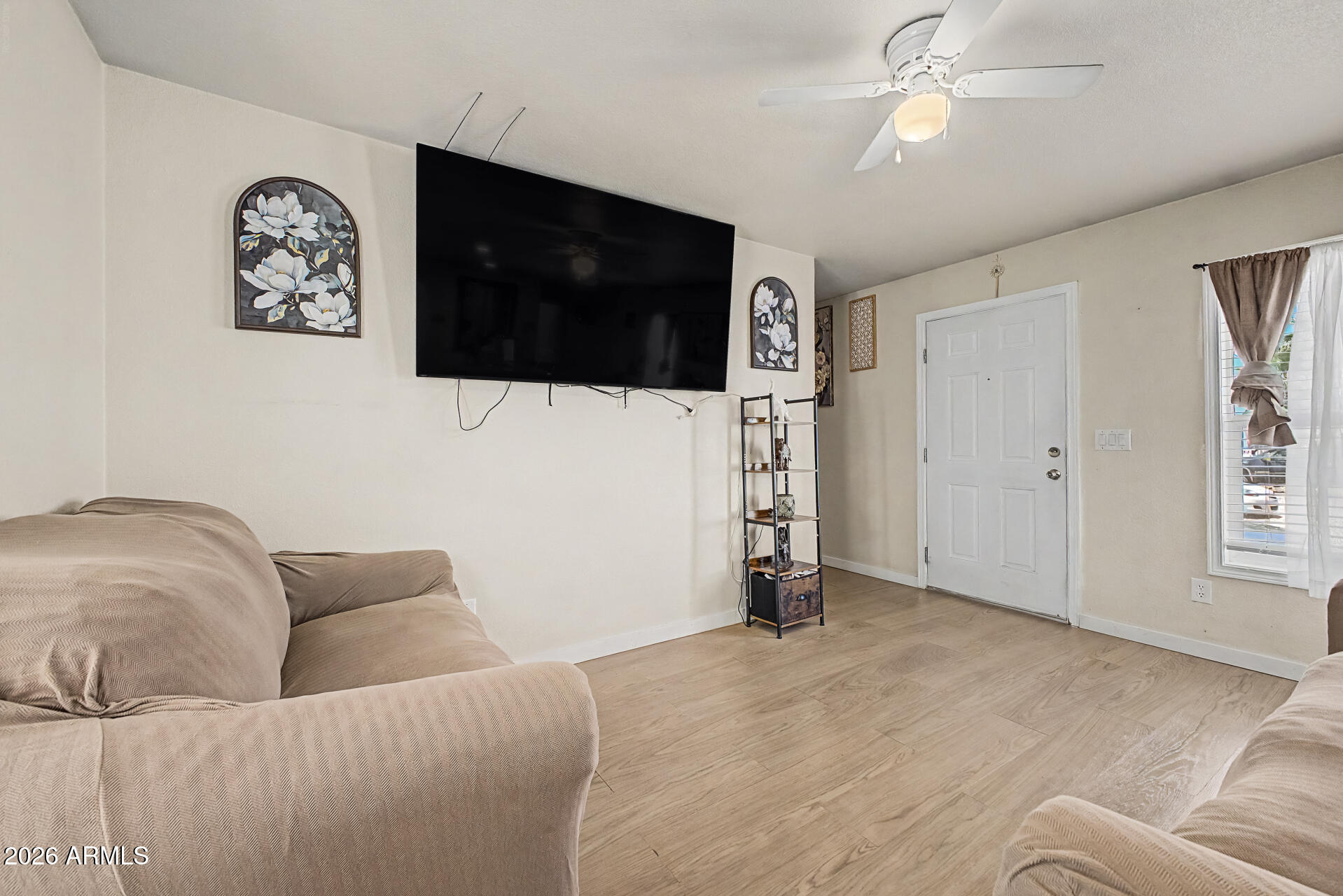 625 West McKellips Road, Unit 393 Mesa, AZ 85201 - Photo 4 of 21 a living room with furniture and a flat screen tv