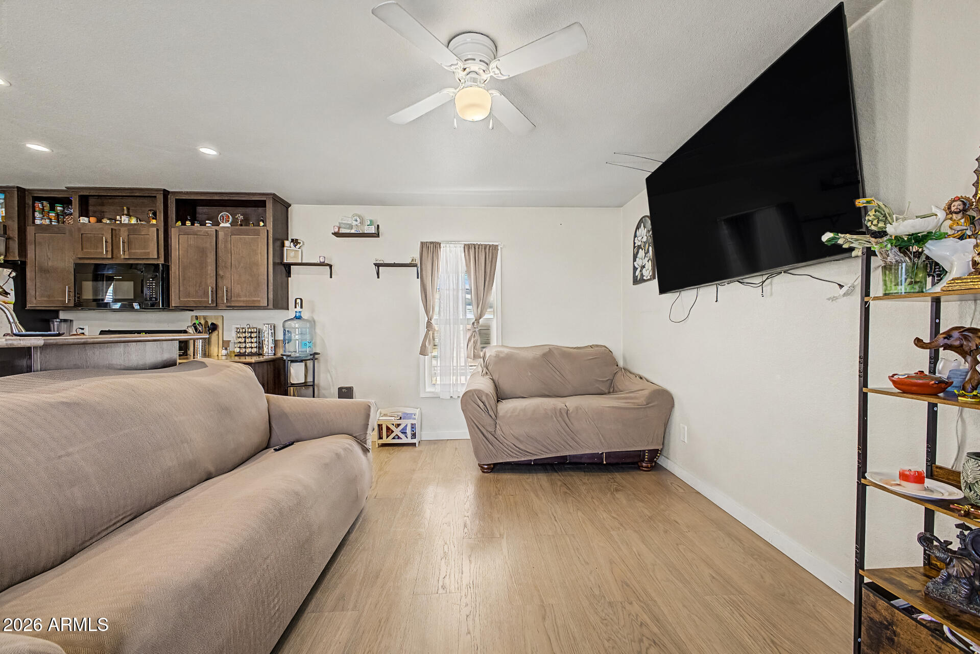 625 West McKellips Road, Unit 393 Mesa, AZ 85201 - Photo 5 of 21 a living room with furniture and a flat screen tv