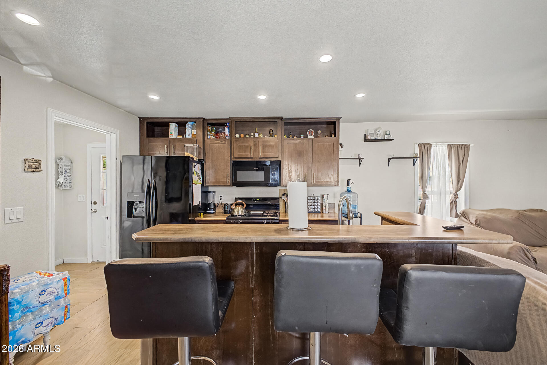 625 West McKellips Road, Unit 393 Mesa, AZ 85201 - Photo 6 of 21 a dining room with furniture a window and a kitchen