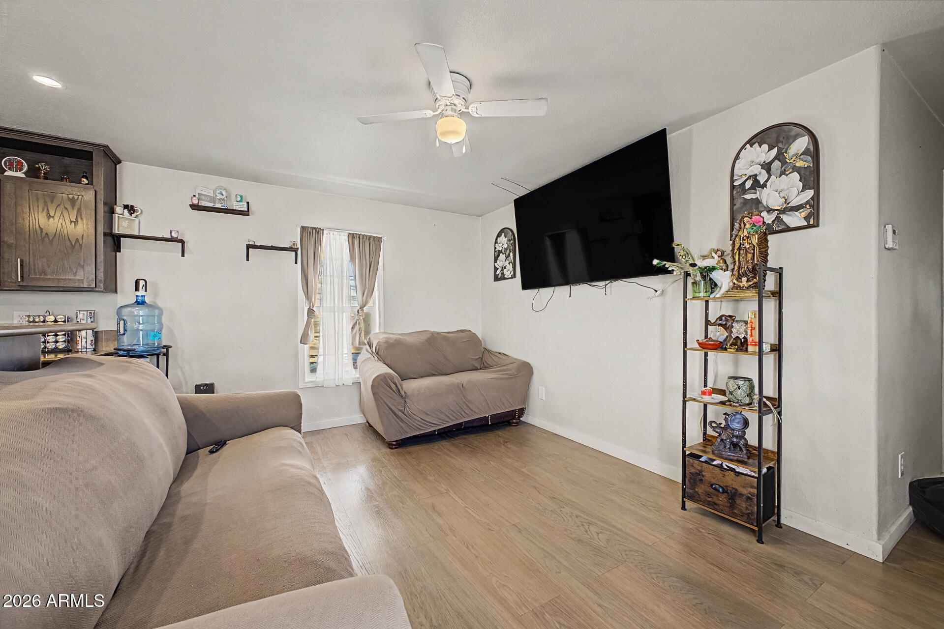 625 West McKellips Road, Unit 393 Mesa, AZ 85201 - Photo 7 of 21 a living room with furniture and a flat screen tv