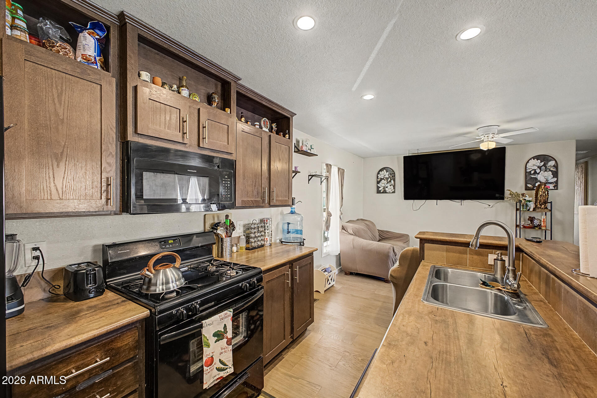 625 West McKellips Road, Unit 393 Mesa, AZ 85201 - Photo 9 of 21 a kitchen with stainless steel appliances granite countertop a sink and a stove