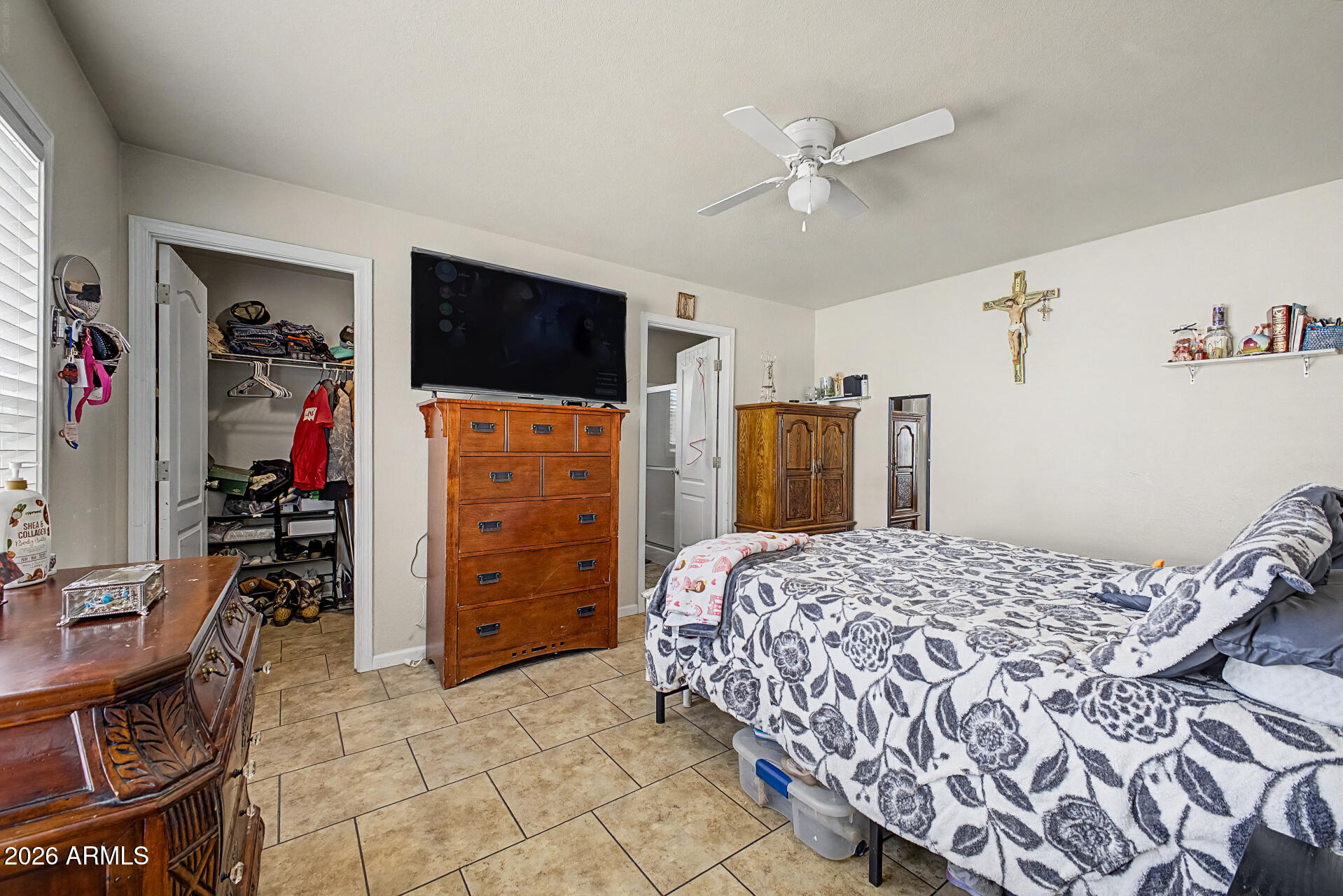 625 West McKellips Road, Unit 393 Mesa, AZ 85201 - Photo 10 of 21 a bedroom with a bed and a flat tv screen