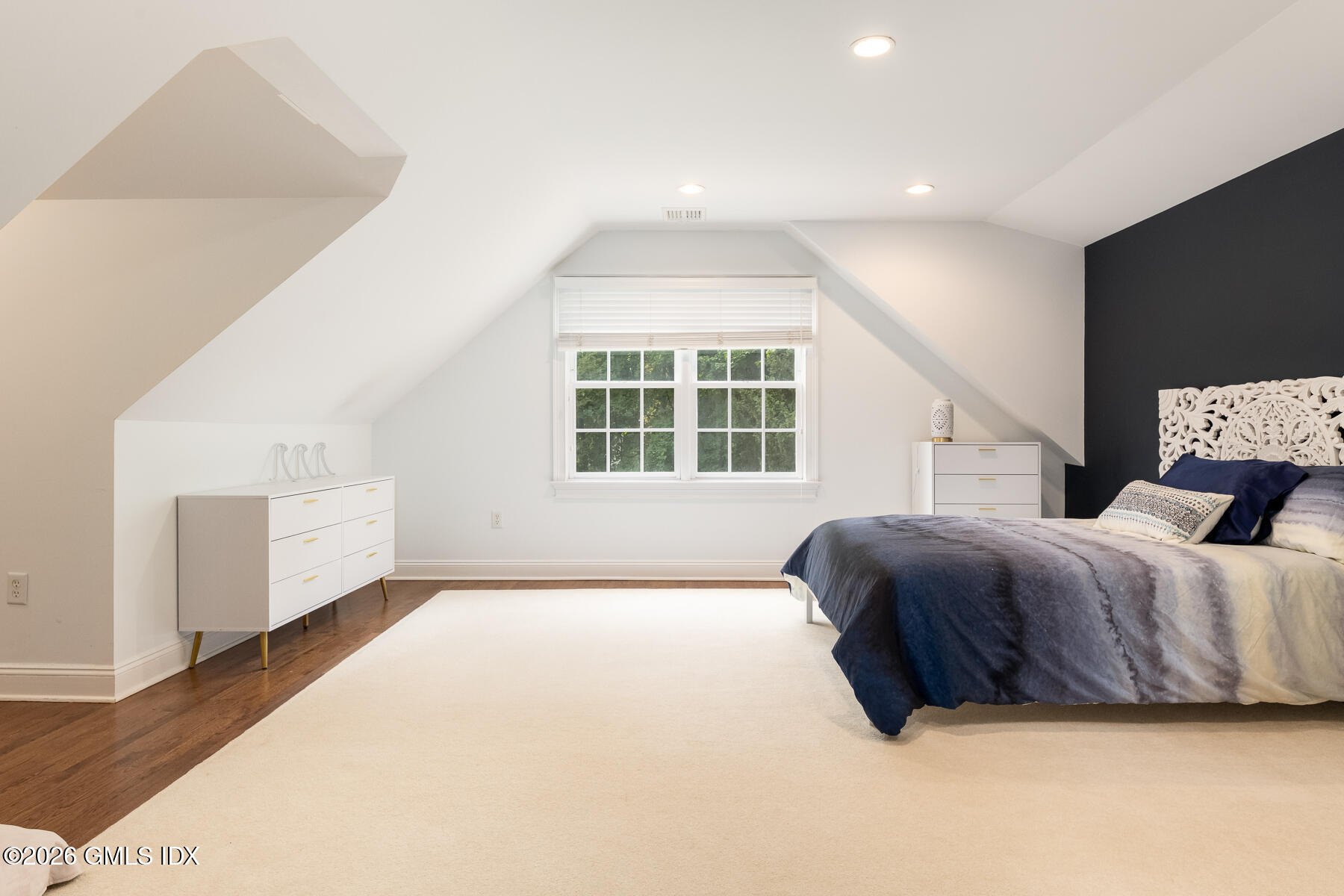 274 Riverside Avenue Riverside, CT 06878 - Photo 12 of 21 a spacious bedroom with a bed and wooden floor