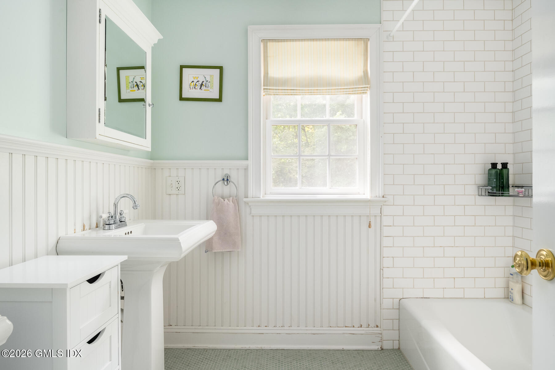 274 Riverside Avenue Riverside, CT 06878 - Photo 15 of 21 a bathroom with a sink a bathtub and a window