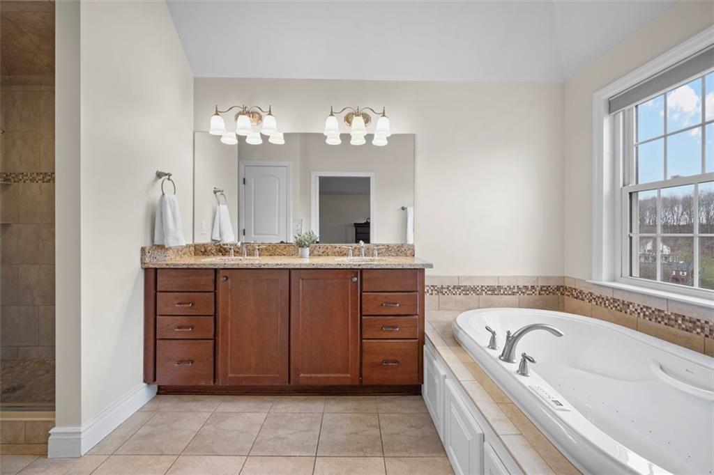 136 Hammond Road Mars, PA 16046 - Photo 23 of 48 a bathroom with a bathtub sink and mirror