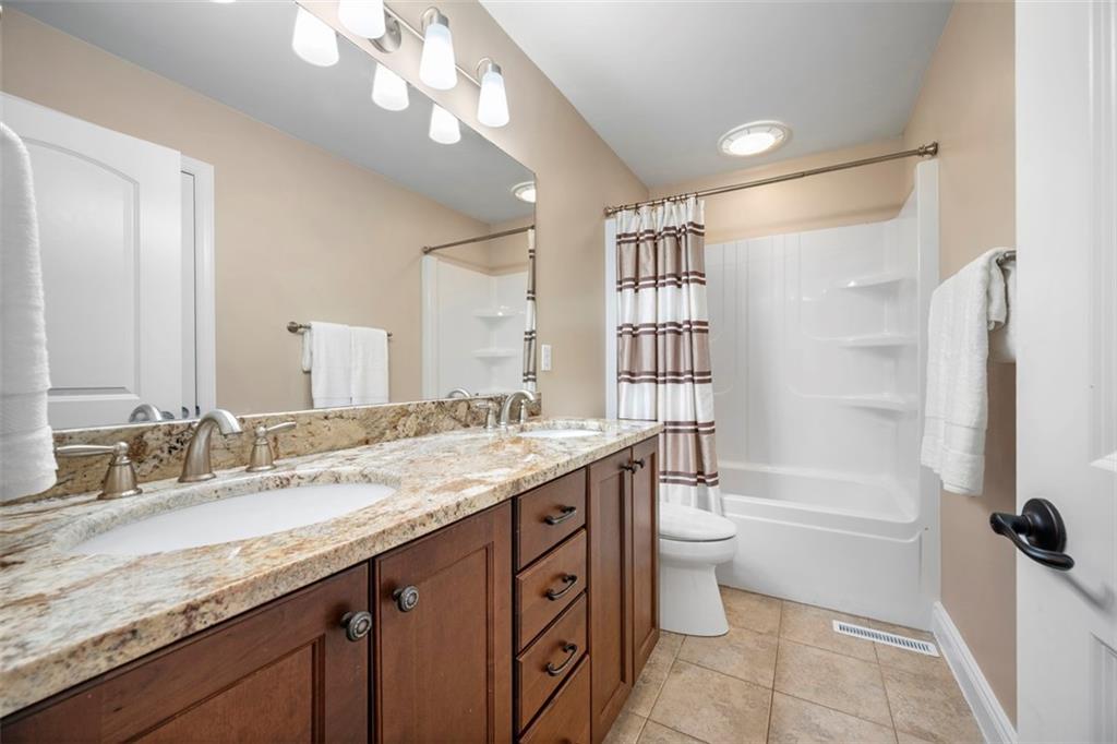 136 Hammond Road Mars, PA 16046 - Photo 31 of 48 a bathroom with a granite countertop sink a toilet a shower and a mirror