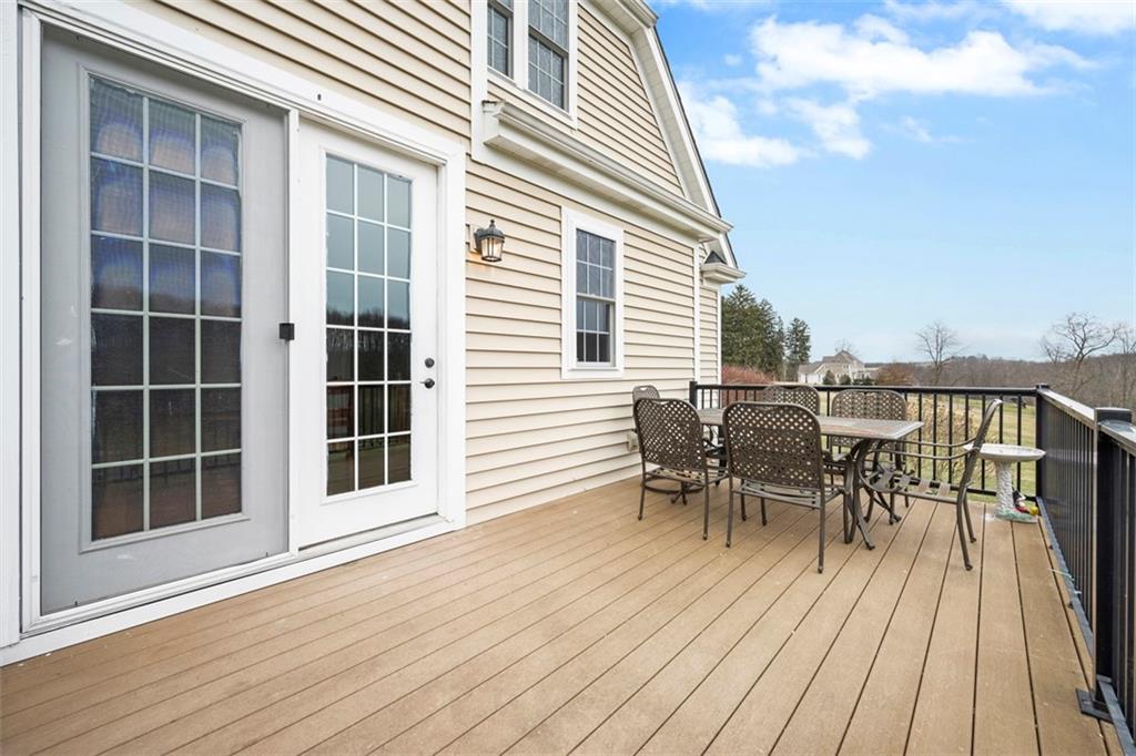 136 Hammond Road Mars, PA 16046 - Photo 33 of 48 a view of a roof deck with table and chairs floor to ceiling window with wooden floor