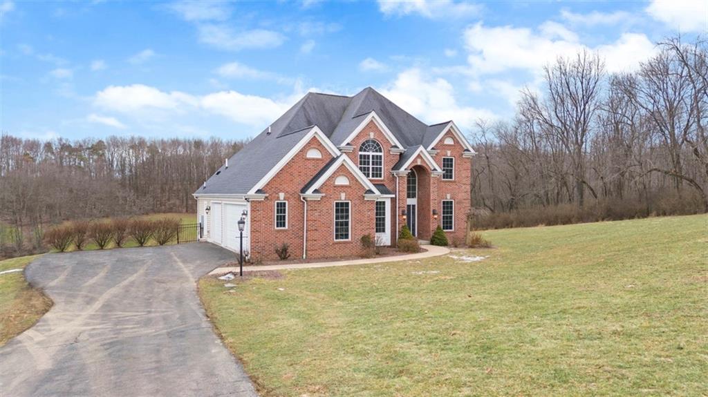136 Hammond Road Mars, PA 16046 - Photo 34 of 48 a front view of a house with a yard and garage