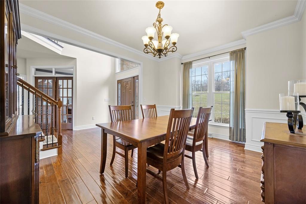 136 Hammond Road Mars, PA 16046 - Photo 4 of 48 a view of a dining room with furniture a chandelier and wooden floor