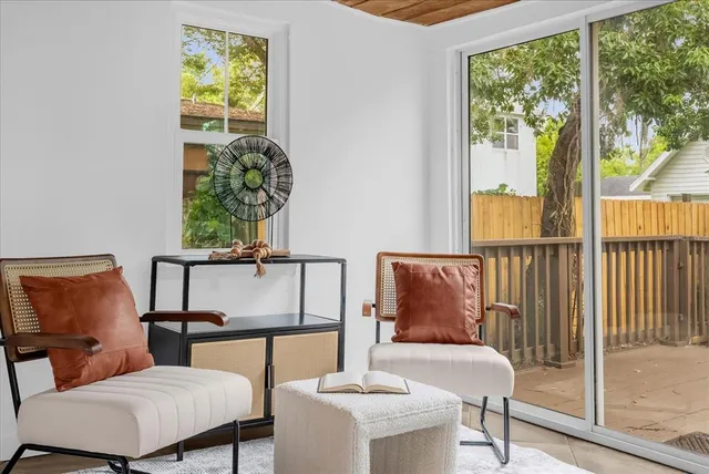 a balcony with table and chairs