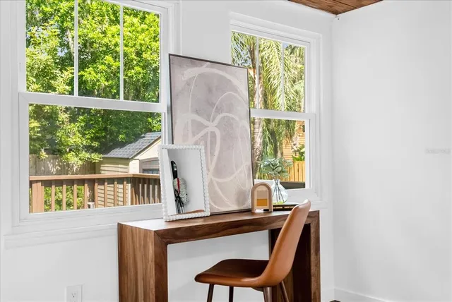 a room that has a window and a chair