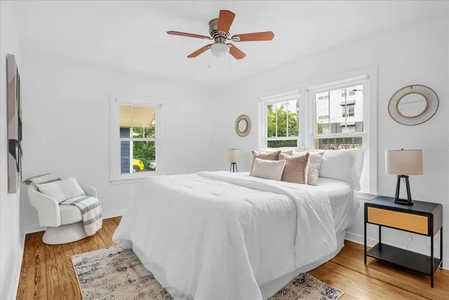 a bedroom with a bed and a window