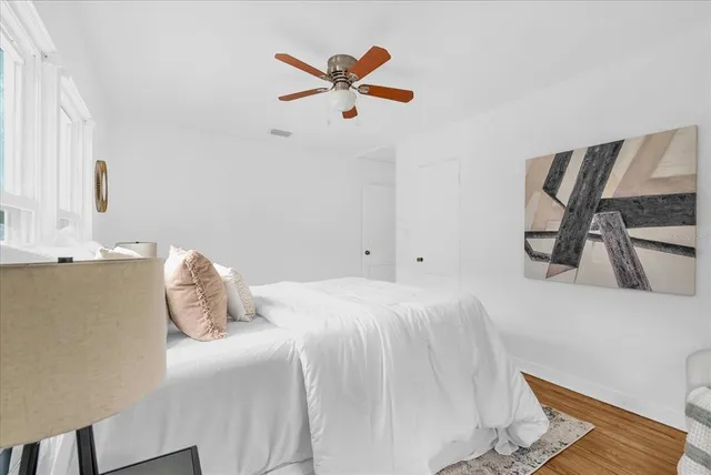 a bedroom with a bed and cabinets