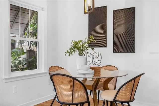 a view of a dining room with furniture and window